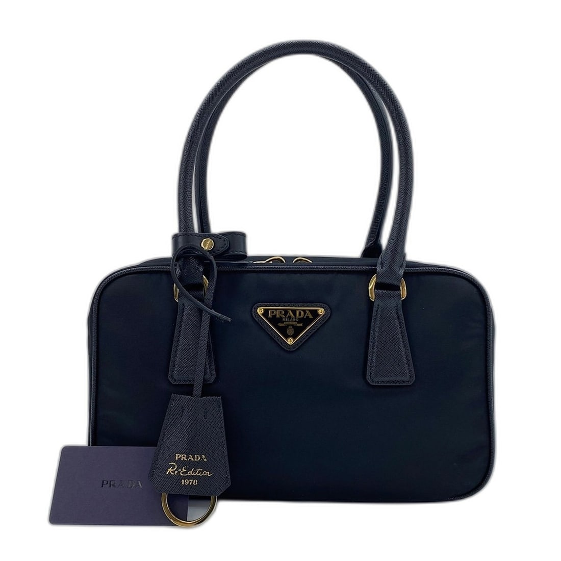 Prada PRADA Re-Edition 1978 Handbag Nylon Black: --- Catalog ---Category: SizeSize (HxWxD): 15cm x 25cm x 8cm / 5.9'' x 9.84'' x 3.14''Category: DesignType: HandbagColor: BlackGender: WomenMaterial: Nylon Category: GeneralBrand: Prada--- Item List