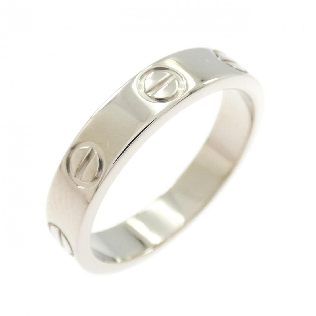 Cartier Mini Love Ring: --- Catalog ---Category: SizeUS Size: 5Brand Size: 49Category: DesignType: Band ringGender: WomenMaterial: White gold (18K)Category: GeneralBrand: Cartier--- Item List ---Section: ConditionRanking: Ra