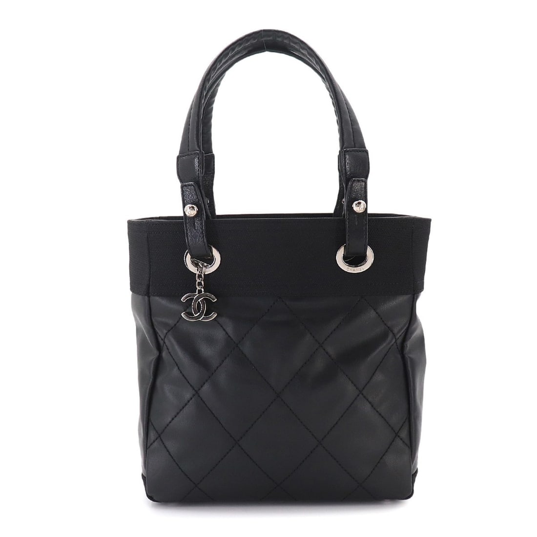 Chanel Paris Biarritz PM Tote Handbag, Nylon and Leather, Black, A34208, Silver Hardware: --- Catalog ---Category: SizeSize (HxWxD): 26.5cm x 25cm x 11cm / 10.43'' x 9.84'' x 4.33''Category: DesignType: Handbag, Tote bagColor: BlackGender: WomenMaterial: Synthetic leather Category: General