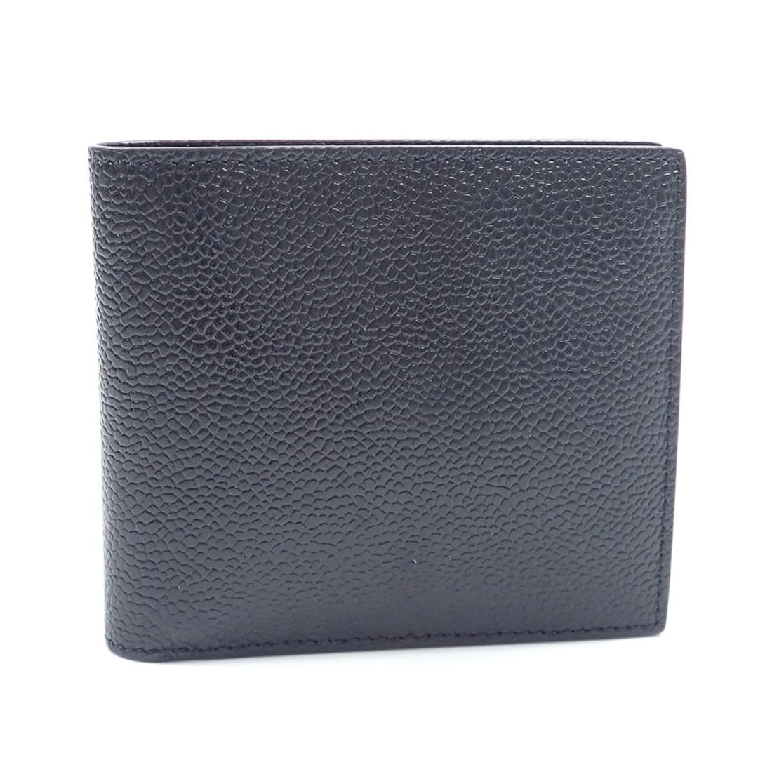 Thom Browne men's bi-fold wallet, black leather.: --- Catalog ---Category: SizeSize (HxWxD): 10cm x 11cm x 1.5cm / 3.93'' x 4.33'' x 0.59''Category: DesignType: Wallet (bi-fold)Color: BlackGender: MenMaterial: Leather Category: GeneralBrand: Thom Bro