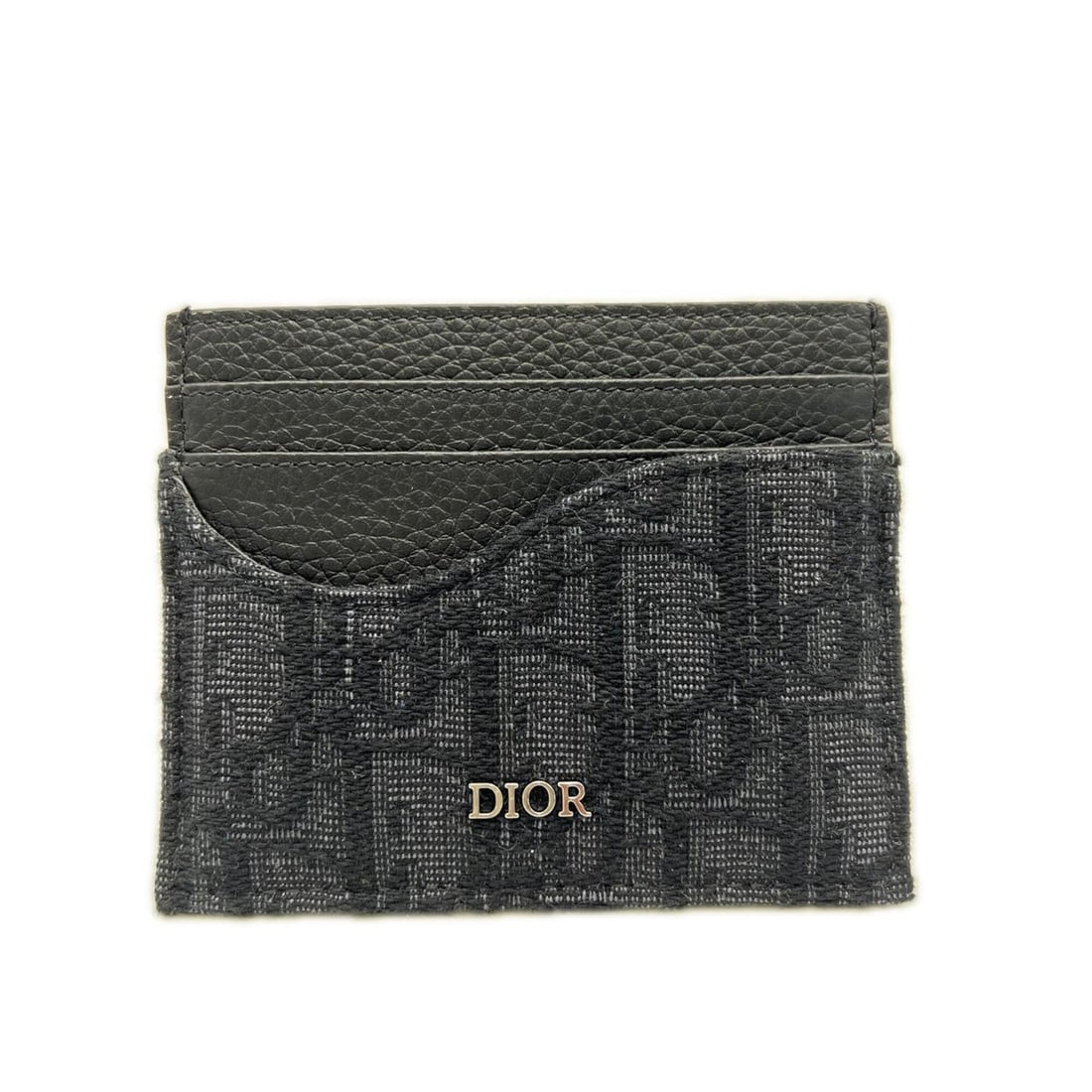 Christian Dior Dior Grained Calfskin Marquetry & Oblique Jacquard Saddle Card Holder 2ADCH164YKS: --- Catalog ---Category: DesignType: Card caseColor: BlackGender: MenMaterial: Jacquard Category: GeneralMPN: 2ADCH164YKSBrand: Christian DiorCategory: Physical PropertiesSize (HxWxD): 8cm x 10cm x 5m