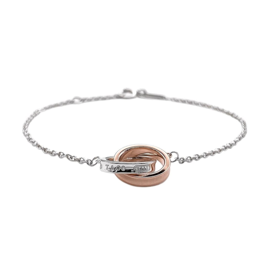 TIFFANY&Co. Interlocking Circle Bracelet SV925 Rubedo Metal Silver Women's: --- Catalog ---Category: SizeLength: 18cm / 7.08''Category: DesignType: Charm braceletColor: Gold, SilverGender: WomenMaterial: Metal, Silver 925Category: GeneralBrand: Tiffany--- Item List ---Section