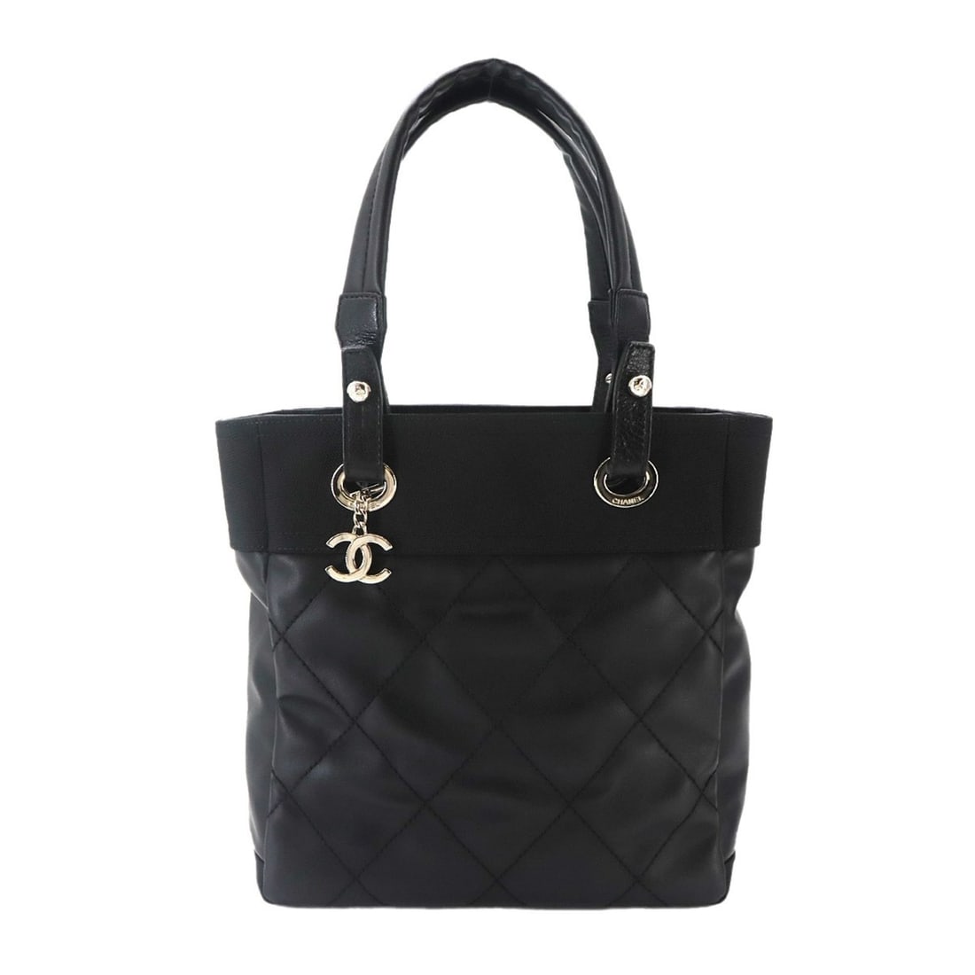 Chanel Paris Biarritz PM Tote Handbag, Nylon and Leather, Black, A34208, Silver Hardware: --- Catalog ---Category: SizeWeight: 705g / 1.55lb.Size (HxWxD): 26.5cm x 25cm x 11cm / 10.43'' x 9.84'' x 4.33''Handle Length: 43cm / 16.92''Category: DesignType: Handbag, Tote bagColor: BlackGender: