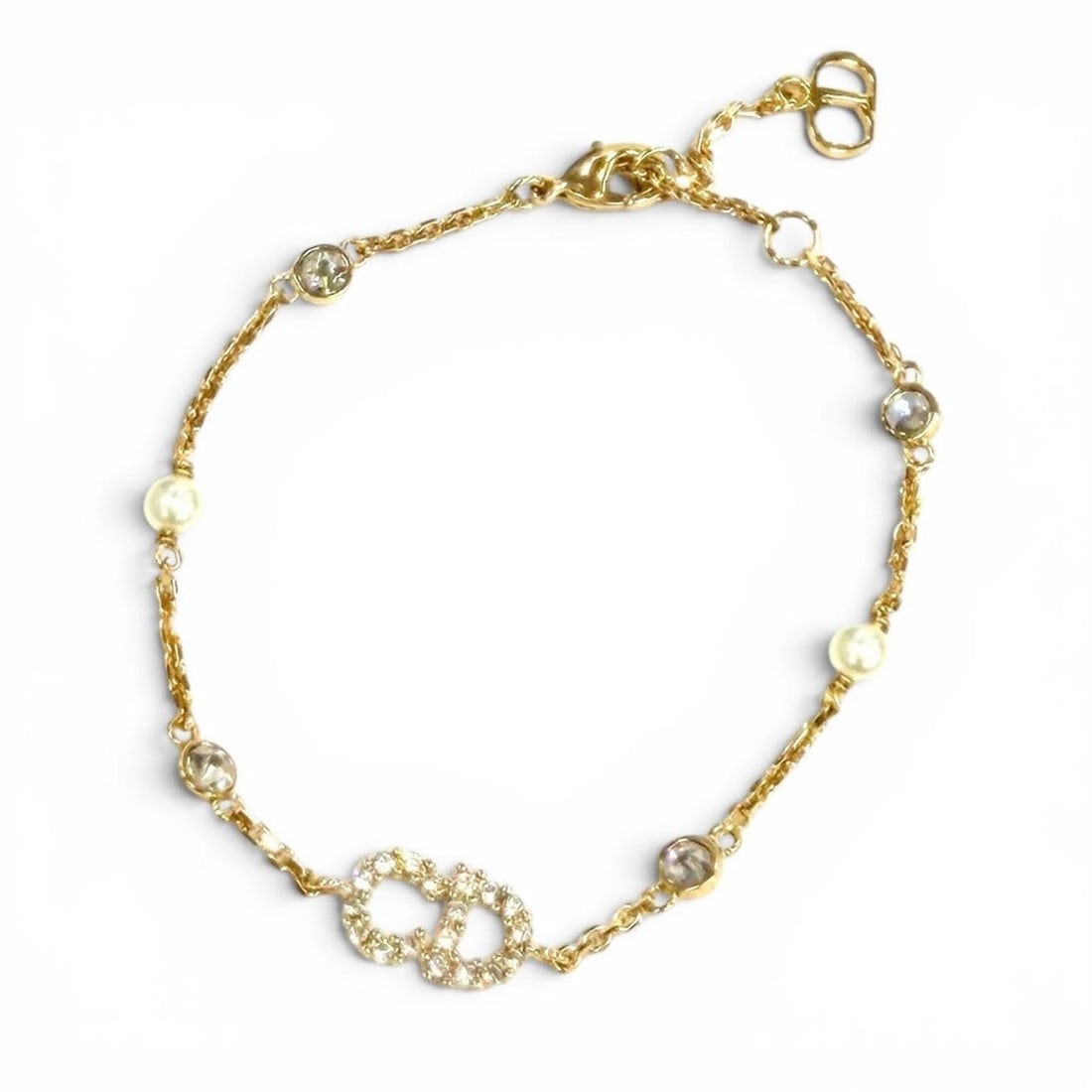 Christian Dior DIOR B3106WOMZI Claire D Lune Bracelet with CD logo, rhinestones, and faux pearls,: --- Catalog ---Category: SizeLength: 15.5cm - 16cm / 6.1'' - 6.29''Category: DesignType: Charm braceletColor: GoldGender: WomenCategory: GeneralMPN: B3106WOMZIBrand: Christian Dior--- Item List ---Sec
