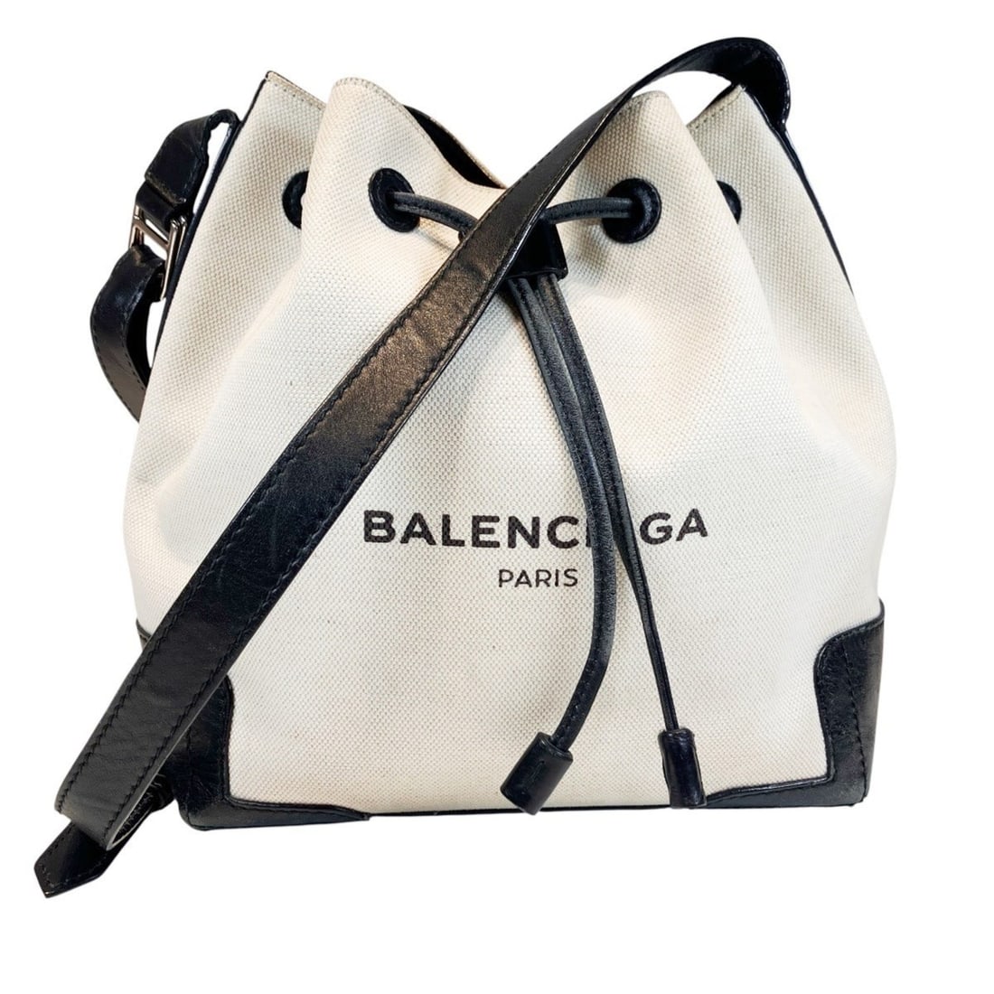 Balenciaga Navy Bucket Shoulder Bag, Canvas and Leather, 409000: --- Catalog ---Category: SizeSize (HxWxD): 24cm x 22cm x 15cm / 9.44'' x 8.66'' x 5.9''Strap Length: 90cm - 125cm / 35.43'' - 49.21''Category: DesignType: Shoulder bagColor: Black, WhiteGender: WomenM