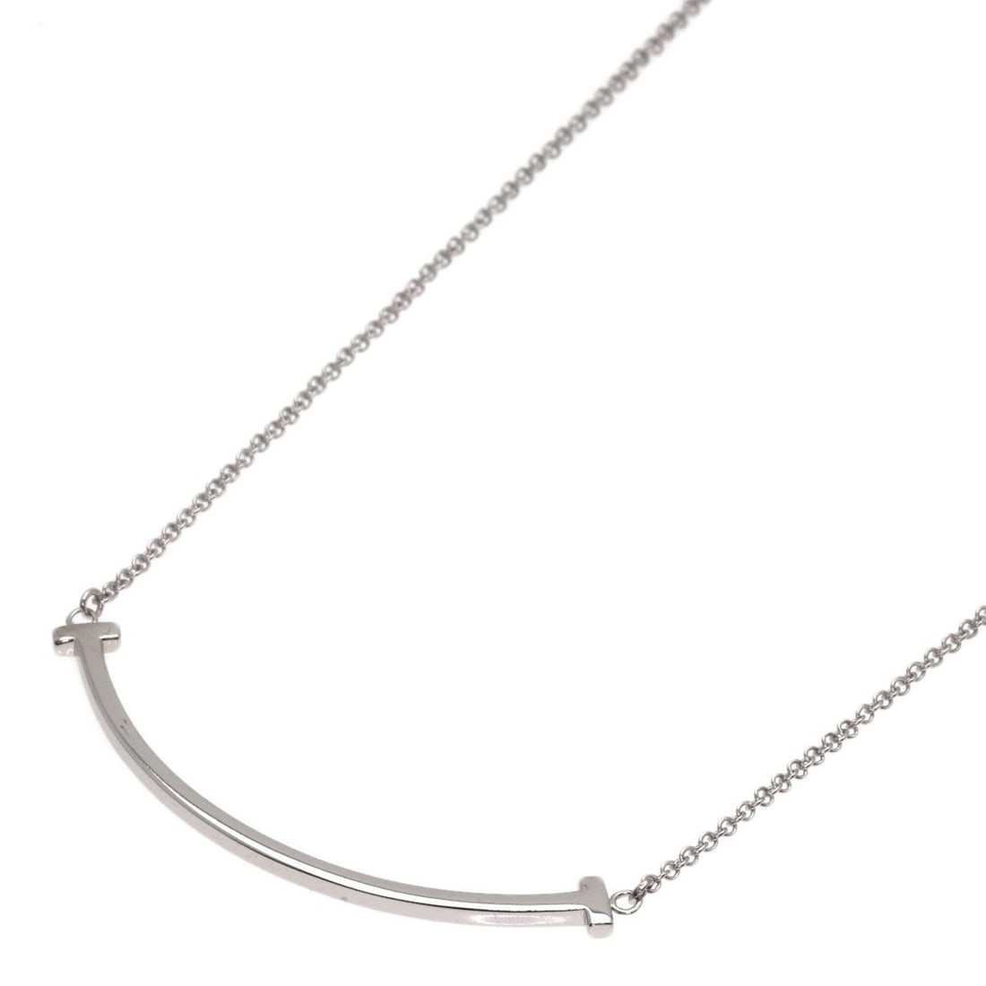Tiffany & Co. T Smile Small Necklace, 18K White Gold, Women's.: --- Catalog ---Category: SizePendant Size: 3.6mm x 37.6mm / 0.14'' x 1.48''Neck Circumference: 45 cm / 17.71''Category: DesignGender: WomenMaterial: White gold (18K)Necklace Type: NecklaceCategory: Ge
