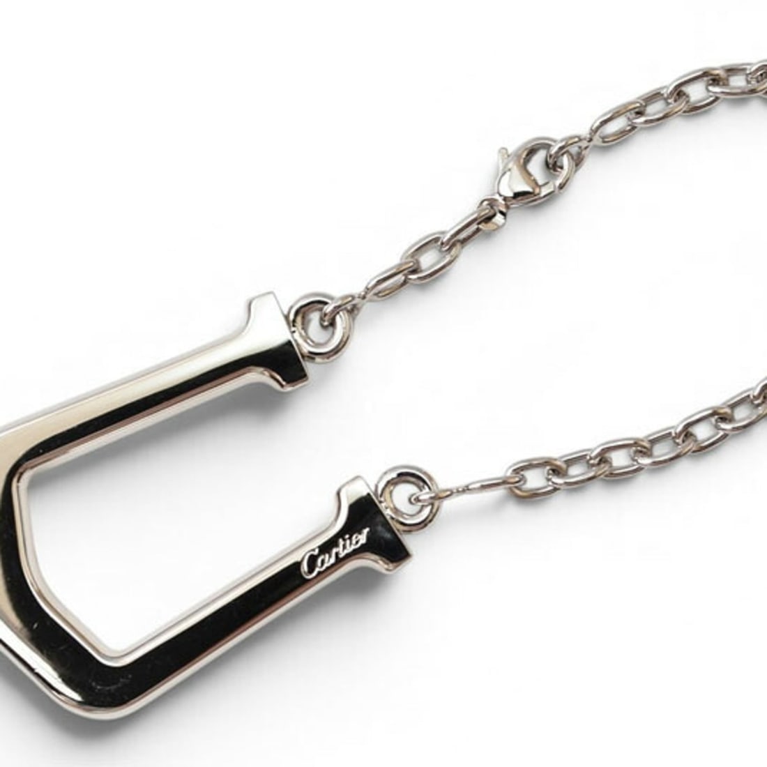 Cartier Bag Charm Keychain C Elongated Silver Stainless Steel Keyring Men's Women's: --- Catalog ---Category: SizeSize (HxWxD): 4cm x 3cm / 1.57'' x 1.18''Category: DesignColor: SilverGender: Men,WomenMaterial: Stainless steelCategory: GeneralBrand: Cartier--- Item List ---Section: Co