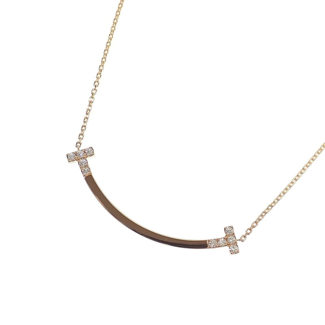 Tiffany & Co. T Smile Necklace, Medium, Women's, Diamond, 0.19ct, 5.7g, 18K Pink Gold 750, Item No.: --- Catalog ---Category: SizeWeight: 5.7g / 0.2oz.Pendant Size: 43mm x 6mm / 1.69'' x 0.23''Neck Circumference: 40.6 cm - 45.7 cm / 15.98'' - 17.99''Category: DesignStone: DiamondGender: WomenMaterial