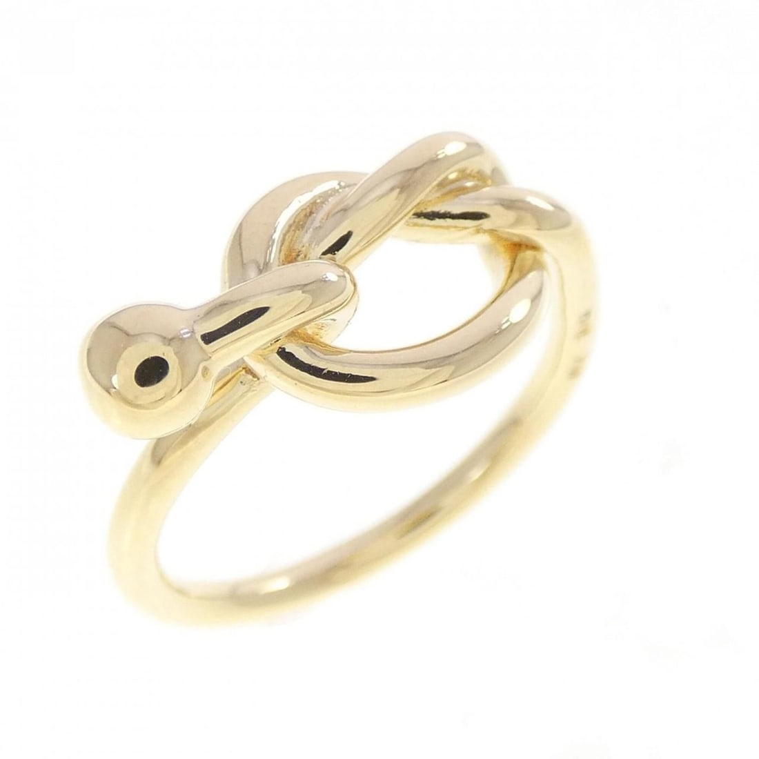 Tiffany Love Knot Ring: --- Catalog ---Category: SizeJP Size: 10US Size: 5.5Category: DesignType: Band ringGender: WomenMaterial: Yellow gold (18K)Category: GeneralBrand: Tiffany--- Item List ---Section: ConditionRanking: