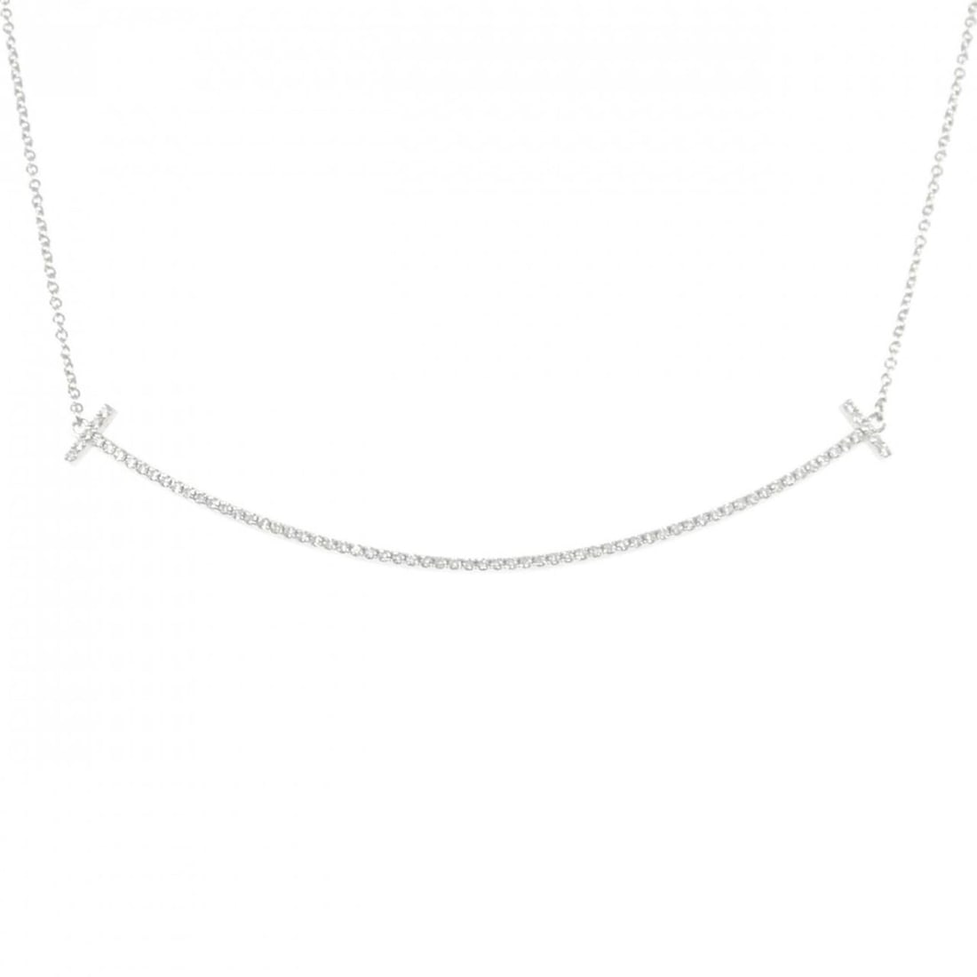 Tiffany T Smile Necklace: --- Catalog ---Category: SizePendant Size: 5.9mm x 67.5mm / 0.23'' x 2.65''Neck Circumference: 41 cm - 45 cm / 16.14'' - 17.71''Category: DesignGender: WomenMaterial: White gold (18K)Pendant Type: