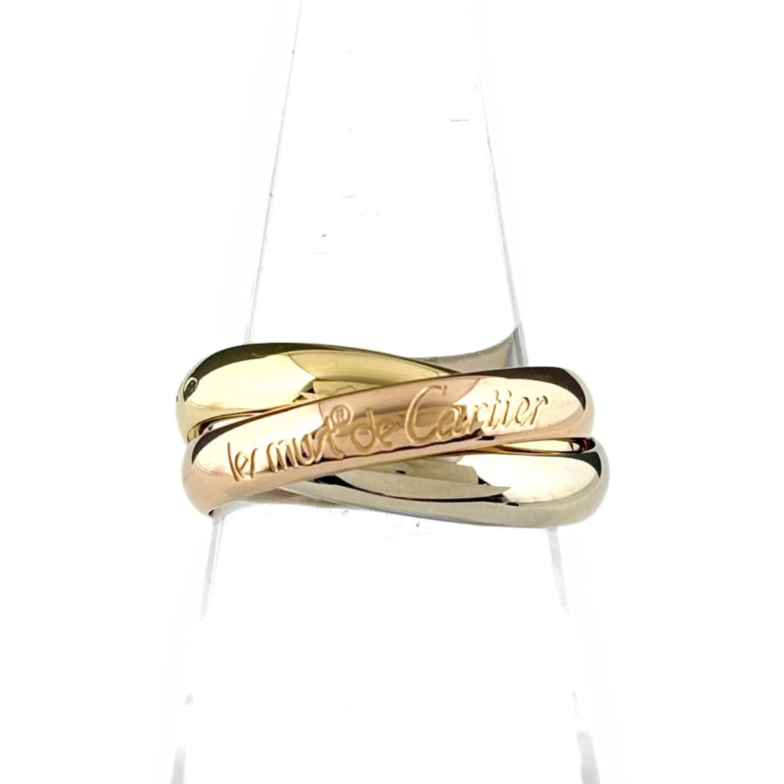 Cartier Trinity Ring, available in yellow gold (YG), pink (PG), and white (WG). Three-color design,: --- Catalog ---Category: SizeUS Size: 6Brand Size: 51Category: DesignType: Band ringGender: WomenMaterial: Pink gold (18K), White gold (18K), Yellow gold (18K)Category: GeneralBrand: Cartier--- Item L