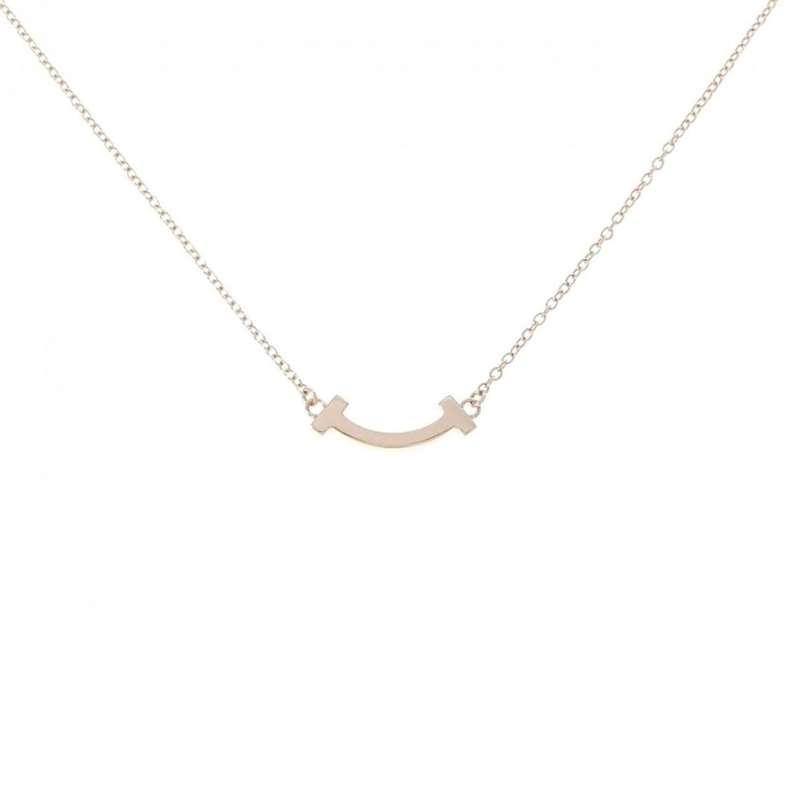 Tiffany T Smile Mini Necklace: --- Catalog ---Category: SizePendant Size: 4.6mm x 13.4mm / 0.18'' x 0.52''Neck Circumference: 41 cm - 45 cm / 16.14'' - 17.71''Category: DesignGender: WomenMaterial: Pink gold (18K)Pendant Type: