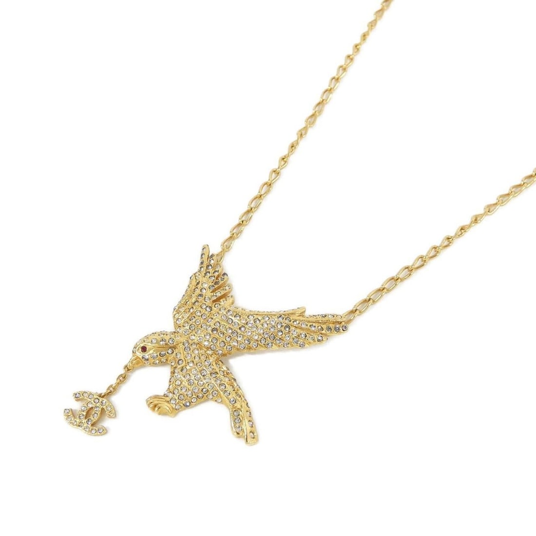 Chanel necklace: --- Catalog ---Category: SizePendant Size: 56mm x 38mm / 2.2'' x 1.49''Neck Circumference: 44 cm - 49 cm / 17.32'' - 19.29''Category: DesignColor: Gold, Red colorStone: CrystalGender: WomenNecklace