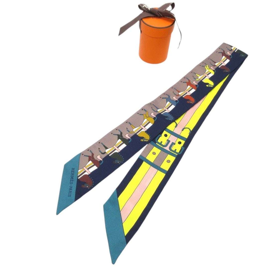 Like new Hermès Twilly Rocabar Horse Belt Scarf Silk Muffler Navy Greige Yellow 0285HERMES: --- Catalog ---Category: SizeSize (LxW): 86cm x 5cm / 33.85'' x 1.96''Category: DesignType: ScarfColor: Navy, YellowGender: WomenMaterial: Silk Category: GeneralBrand: HermesCountry of Origin: France-