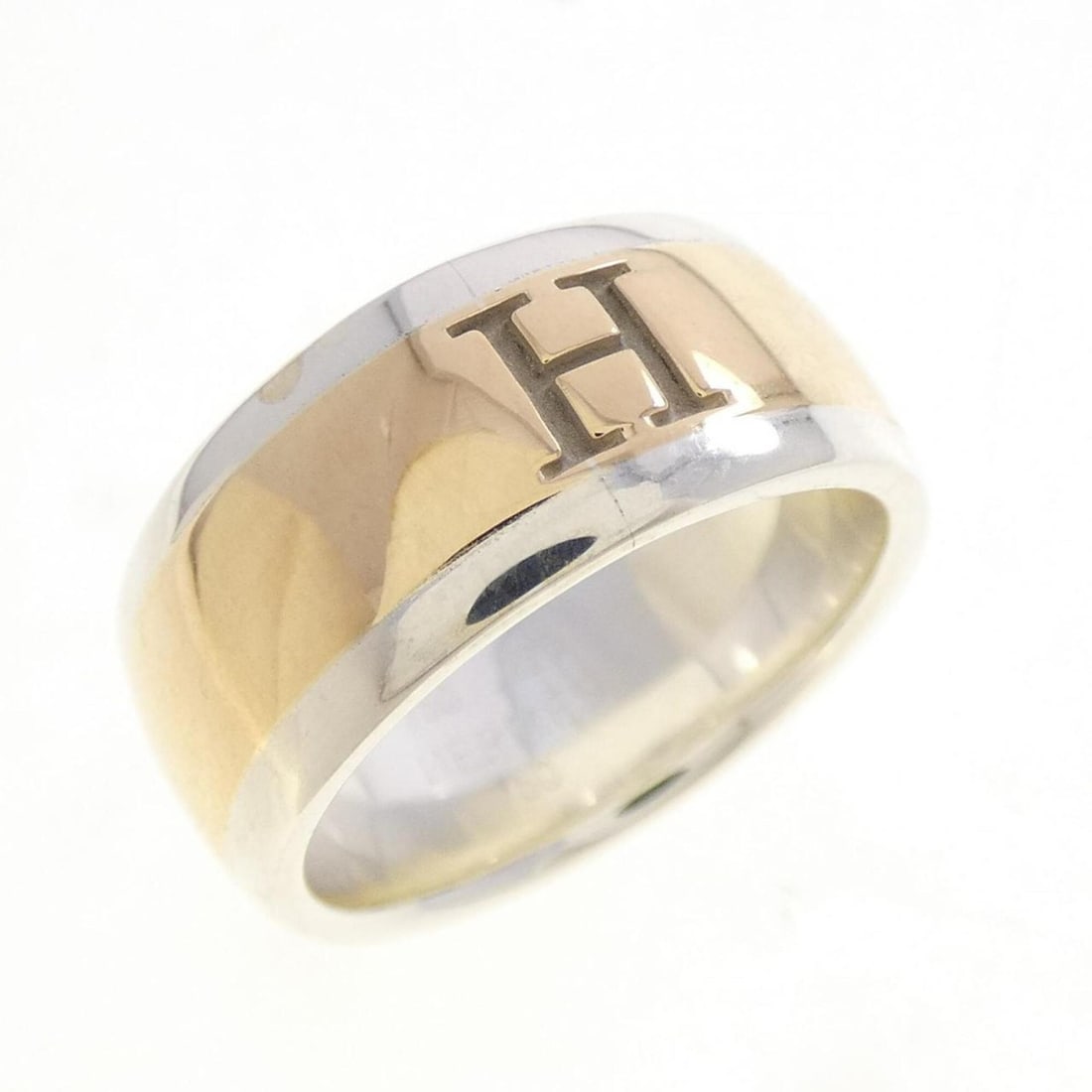 Hermes 925 750YG Ring: --- Catalog ---Category: SizeUS Size: 5.5Brand Size: 50Category: DesignType: Band ringGender: WomenMaterial: Silver 925, Yellow gold (18K)Category: GeneralBrand: Hermes--- Item List ---Section:
