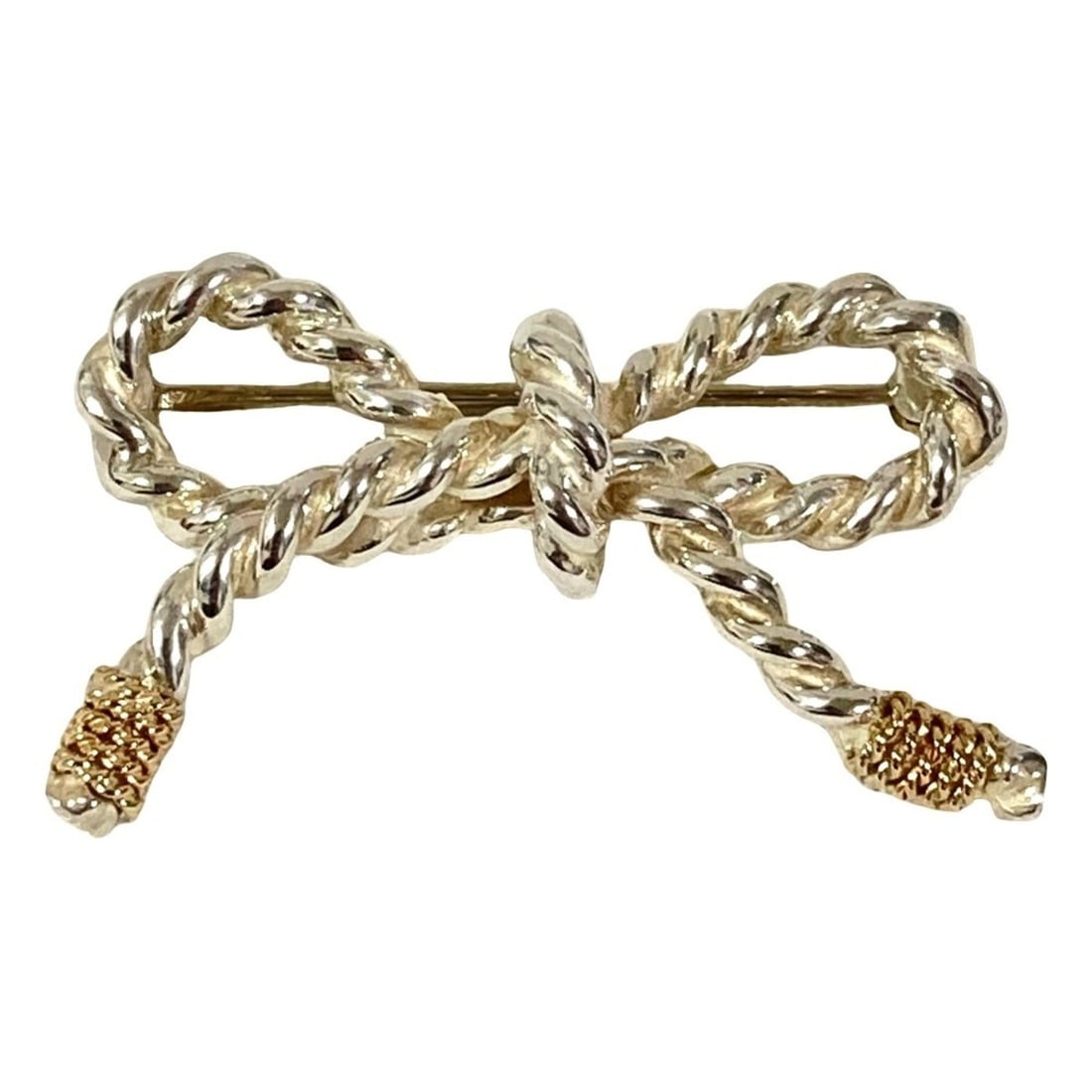 Tiffany & Co. Vintage Twist Ribbon Brooch, Sterling Silver 14K, Silver, Women's: --- Catalog ---Category: SizeSize (HxWxD): 2cm x 3cm / 0.78'' x 1.18''Category: DesignType: BroochColor: SilverGender: WomenCategory: GeneralBrand: Tiffany--- Item List ---Section: ConditionRanking: R