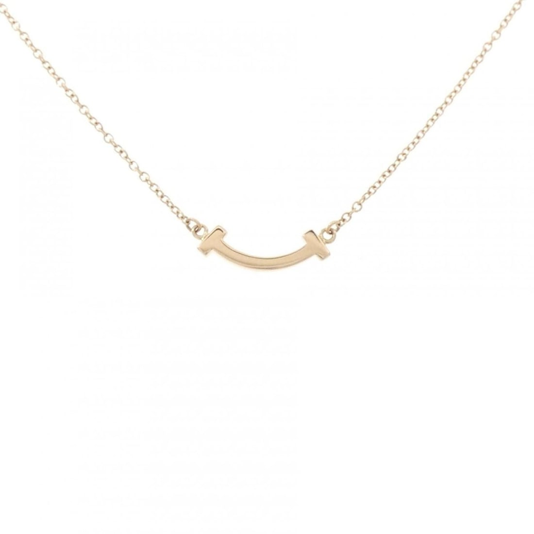 Tiffany T Smile Mini Necklace: --- Catalog ---Category: SizePendant Size: 3.4mm x 13.3mm / 0.13'' x 0.52''Neck Circumference: 41 cm - 46 cm / 16.14'' - 18.11''Category: DesignGender: WomenMaterial: Pink gold (18K)Pendant Type:
