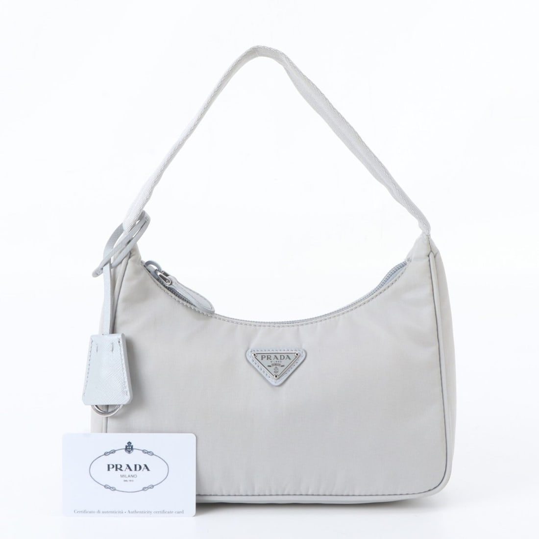 Prada Tessuto Nylon Triangle Logo Leather Shoulder Bag for Women (1NE515) with Guarantee Card: --- Catalog ---Category: SizeSize (HxWxD): 12cm x 22cm x 6cm / 4.72'' x 8.66'' x 2.36''Category: DesignType: Shoulder bagColor: GrayGender: WomenMaterial: Nylon , Leather Category: GeneralBrand: Prada