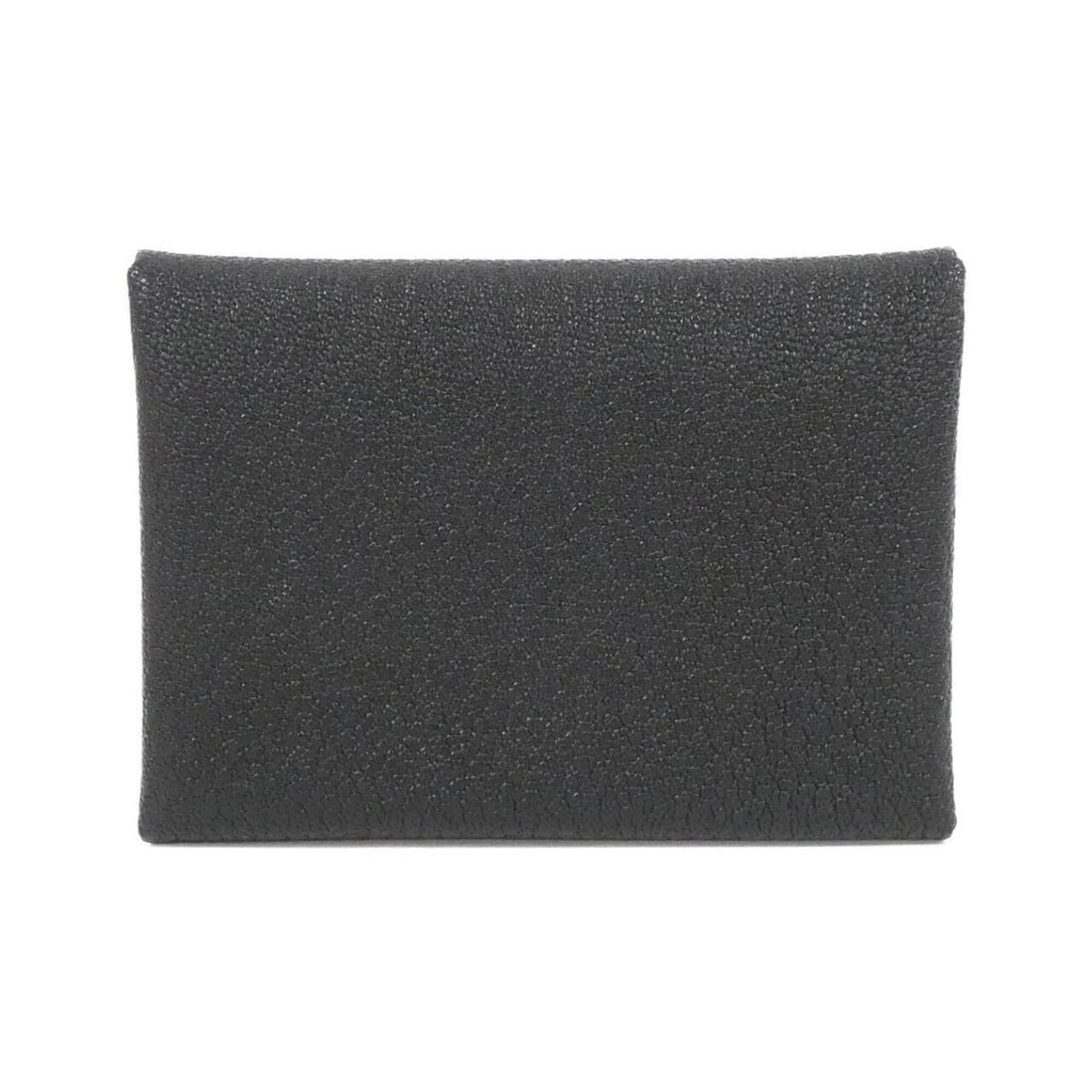 Hermes Calvi Duo 082977CK Wallet/Coin Case: --- Catalog ---Category: SizeSize (HxWxD): 7cm x 10.5cm x 2cm / 2.75'' x 4.13'' x 0.78''Category: DesignType: Coin purse/coin caseColor: BlackGender: WomenMaterial: Chevre leather Category: GeneralBra