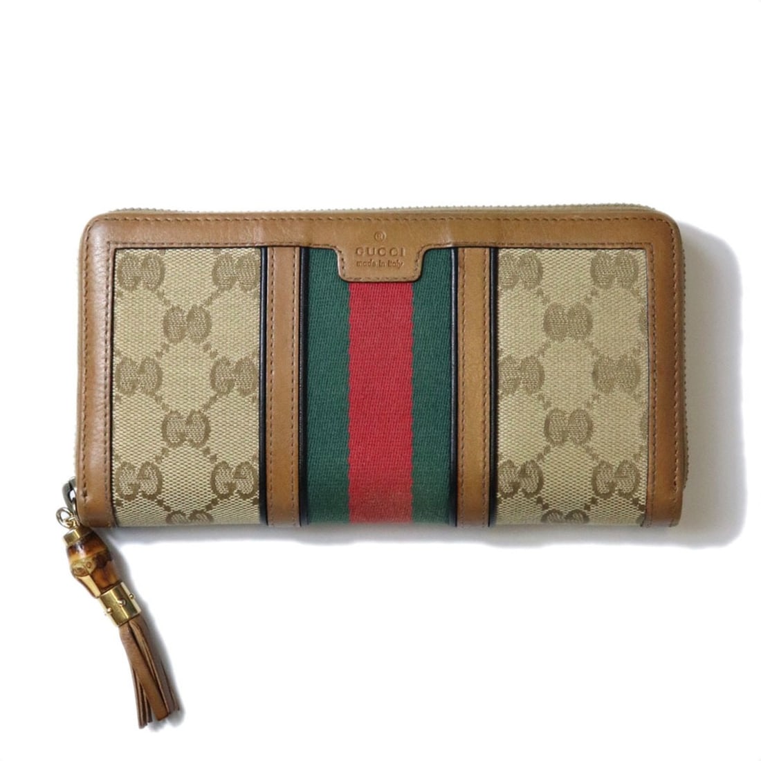 GUCCI 353651 Long Wallet GG Canvas Sherry Bamboo Brown Women's: --- Catalog ---Category: SizeSize (HxWxD): 10cm x 19cm x 2cm / 3.93'' x 7.48'' x 0.78''Category: DesignType: Long wallet (bi-fold)Color: BrownGender: WomenMaterial: GG canvas Category: GeneralBrand: G