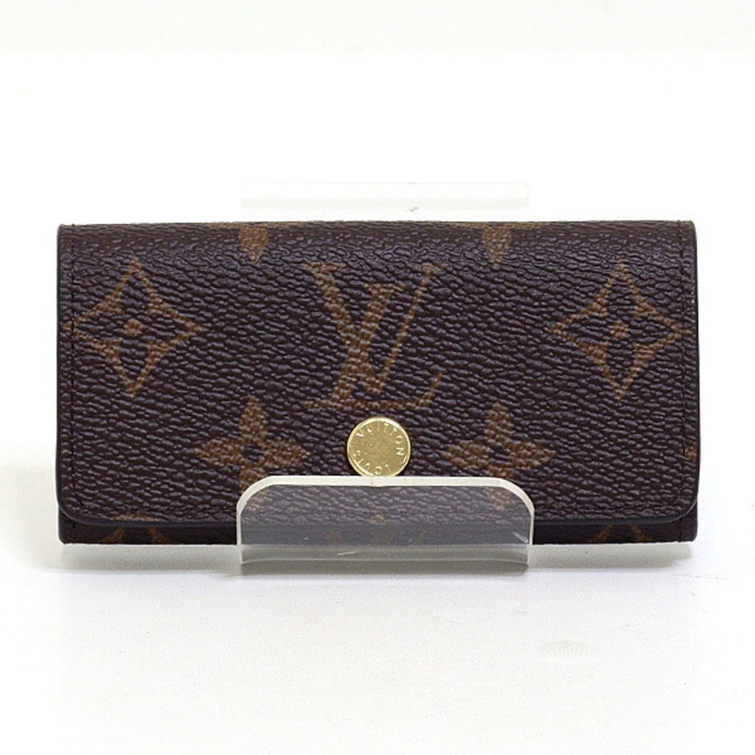 Louis Vuitton Multicles 4 Key Case M69517 Monogram, 4-ring key case, unused.: --- Catalog ---Category: DesignType: KeycaseColor: BrownClosure: FlapMaterial: Monogram , Leather Category: GeneralLine: MonogramBrand: Louis VuittonCountry of Origin: FranceCategory: Physical Propert