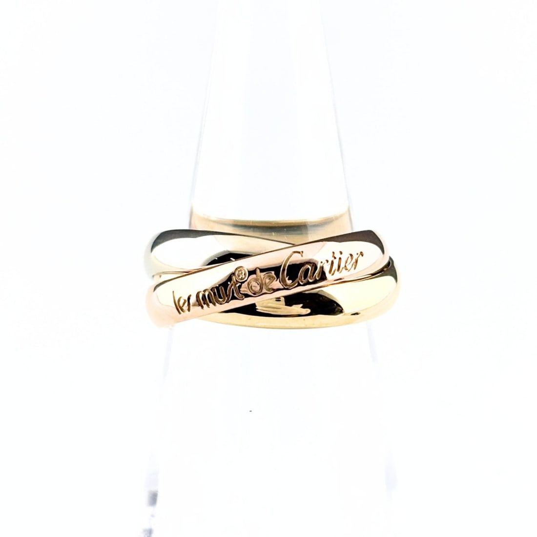 Cartier Trinity Ring, available in yellow gold (YG), pink (PG), and white (WG). Three-color design,: --- Catalog ---Category: SizeUS Size: 5.5Brand Size: 50Category: DesignType: Band ringGender: WomenMaterial: Pink gold (18K), White gold (18K), Yellow gold (18K)Category: GeneralBrand: Cartier--- Item
