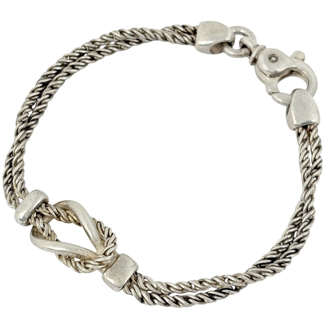 Tiffany & Co. Double Rope Bracelet with Center Knot, Sterling Silver 925, Women's.: --- Catalog ---Category: SizeLength: 17.5cm / 6.88''Category: DesignType: Charm braceletColor: SilverGender: WomenMaterial: Silver 925Category: GeneralBrand: Tiffany--- Item List ---Section: Condition