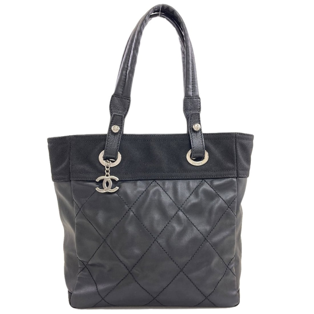 Chanel Paris Biarritz PM Handbag, Coated Canvas, Women's CHANEL: --- Catalog ---Category: SizeSize (HxWxD): 28cm x 26cm x 11.5cm / 11.02'' x 10.23'' x 4.52''Category: DesignType: HandbagColor: BlackGender: WomenMaterial: Coated canvas Category: GeneralBrand: Chanel