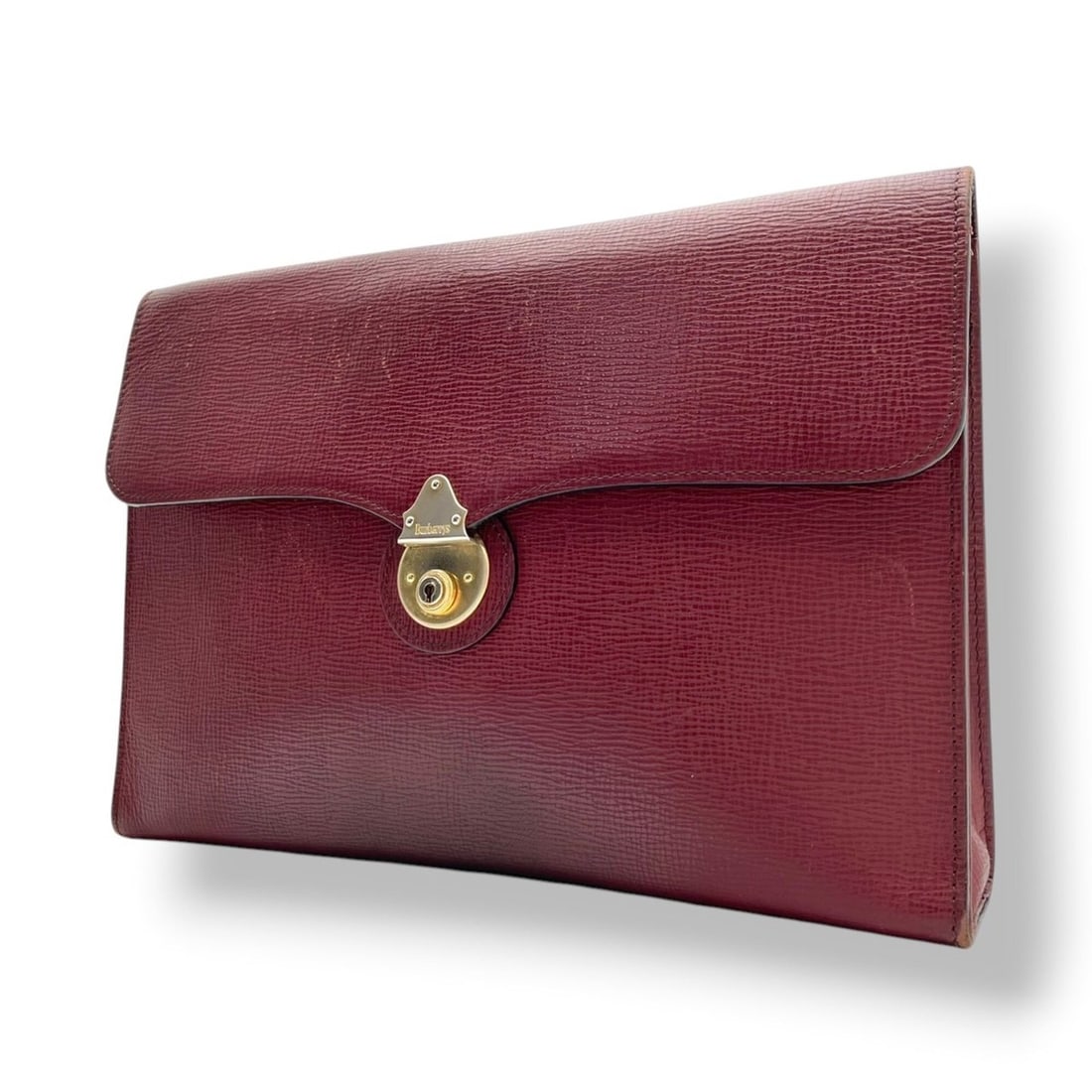 Burberry Embossed Leather Clutch Bag with Flap, Bordeaux/Wine Red, Gold Hardware, Men's/Women's, S90: --- Catalog ---Category: SizeSize (HxWxD): 25cm x 36cm x 6cm / 9.84'' x 14.17'' x 2.36''Category: DesignType: Clutch bagColor: BordeauxGender: Men,WomenMaterial: Leather Category: GeneralBrand: Burber