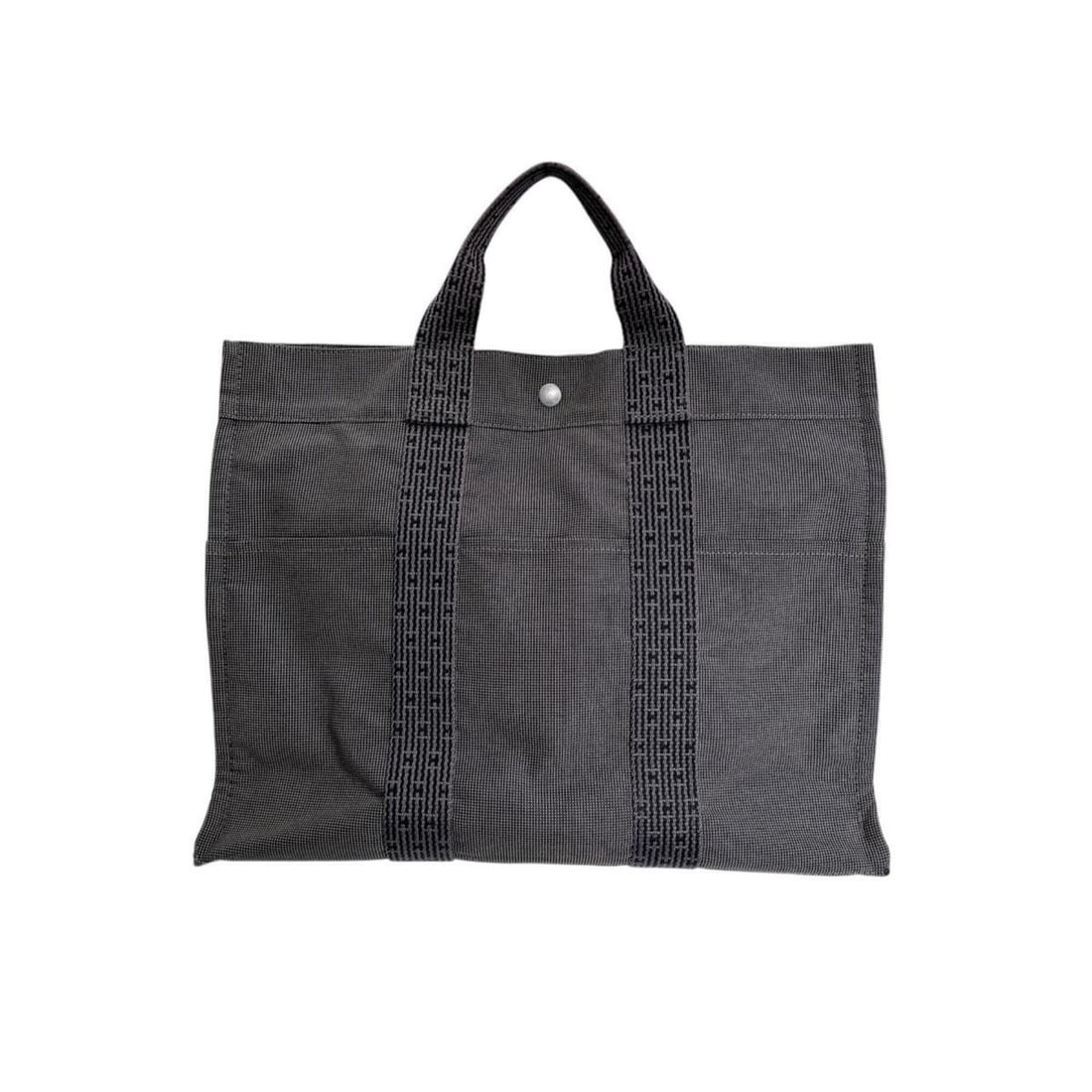HERMES Tote Bag Handbag Canvas Herline MM Nylon 100951M Gray: --- Catalog ---Category: SizeWeight: 800g / 1.76lb.Handle Drop: 10.00cm / 3.94''Size (HxWxD): 33cm x 42cm x 12cm / 12.99'' x 16.53'' x 4.72''Category: DesignType: Handbag, Tote bagColor: GrayGender: U