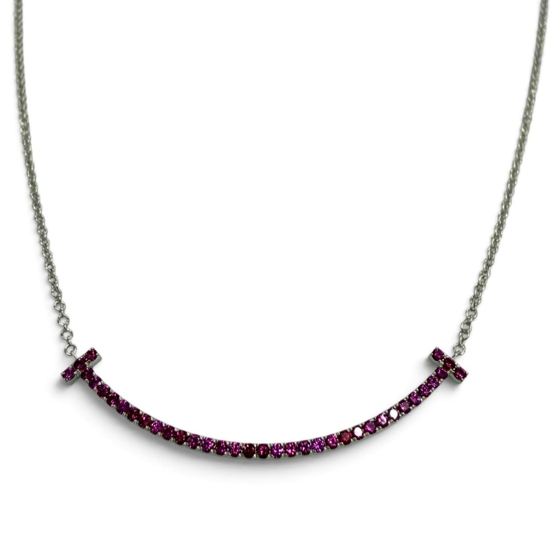 TIFFANY&Co. Tiffany T Smile Small AU750 (WG) Pink Sapphire Necklace, White Gold, Weight 2.61g,: --- Catalog ---Category: SizePendant Size: 35mm / 1.37''Neck Circumference: 40.5 cm - 45 cm / 15.94'' - 17.71''Category: DesignColor: White goldStone: SapphireGender: WomenMaterial: White gold (18K)Ne