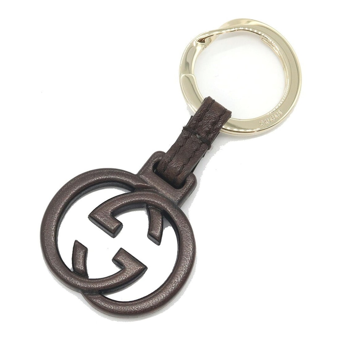 Gucci Interlocking Keyring, Dark Brown Gold Leather, Metal, Double G GG, Accessory, Bag Charm,: --- Catalog ---Category: SizeSize (HxWxD): 9cm x 3.4cm / 3.54'' x 1.33''Category: DesignType: KeyringColor: Dark brown, GoldGender: Men,WomenMaterial: Leather, MetalCategory: GeneralBrand: GucciCountr