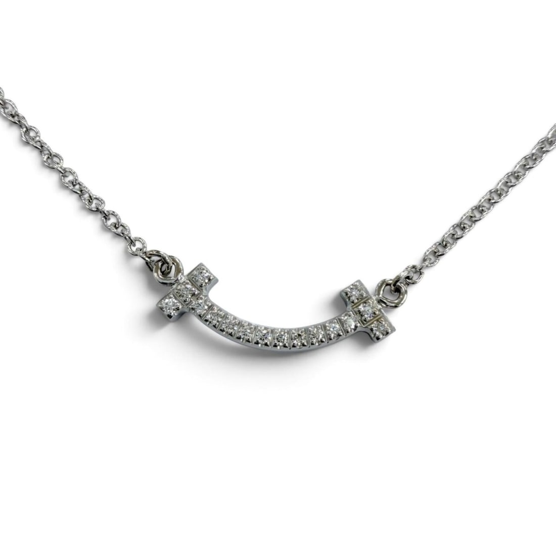 TIFFANY&Co. Tiffany T Smile Pendant Mini AU750 (WG) Diamond Necklace White Gold Weight 2.32g Women's: --- Catalog ---Category: SizePendant Size: 3mm x 15mm / 0.11'' x 0.59''Neck Circumference: 40 cm - 45 cm / 15.74'' - 17.71''Category: DesignColor: White goldStone: DiamondGender: WomenMaterial: White 