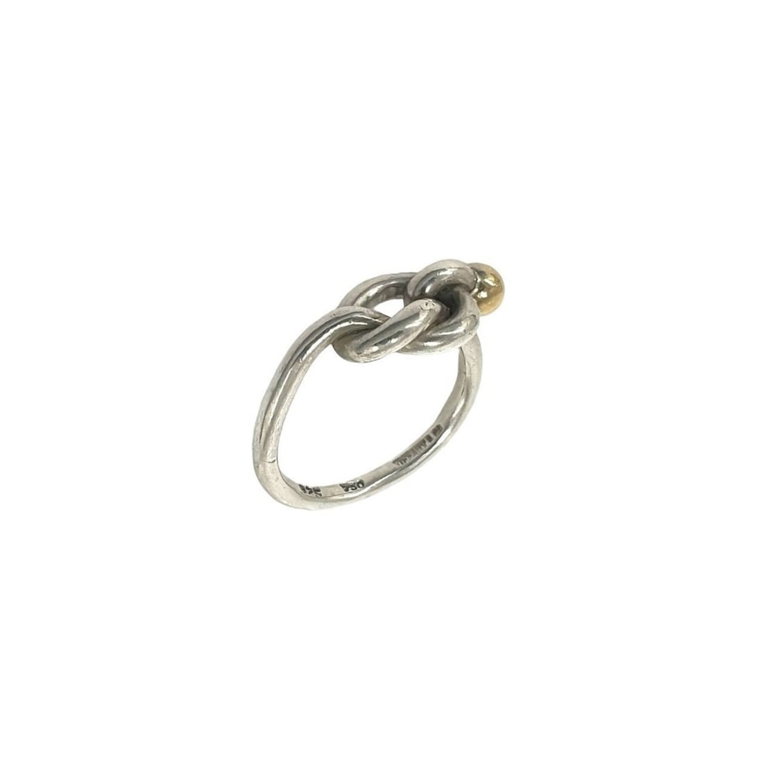 TIFFANY&Co. Tiffany Vintage Love Knot Ring, Sterling Silver 925, 18K 750YG, and Gold, Item No. 30846: --- Catalog ---Category: SizeJP Size: 6US Size: 3.5Category: DesignType: Band ringColor: Gold, SilverGender: WomenMaterial: Silver 925, Yellow gold (18K)Category: GeneralBrand: Tiffany--- Item List --
