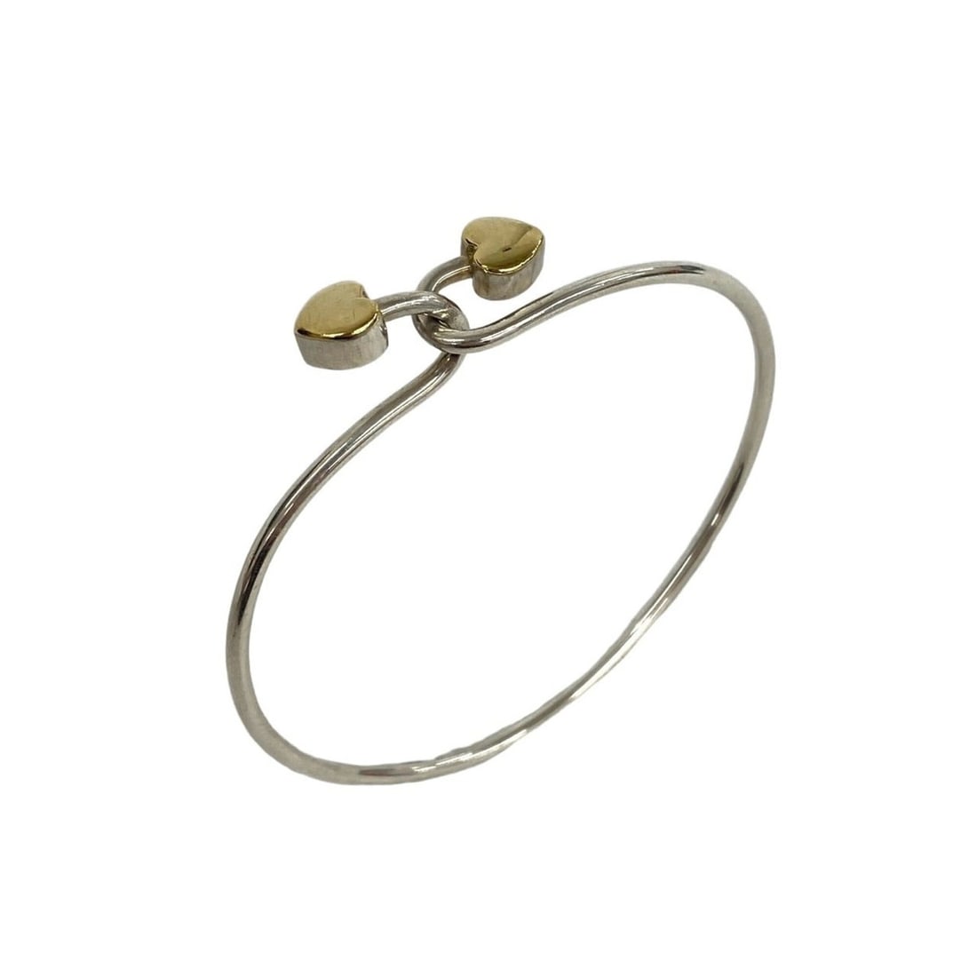 TIFFANY&Co. Tiffany Vintage Solid Double Heart Hook Bangle, Sterling Silver 925, 18K 750YG, & Gold,: --- Catalog ---Category: SizeLength: 16.5cm / 6.49''Category: DesignType: BangleColor: Gold, SilverGender: WomenMaterial: Silver 925, Yellow gold (18K)Category: GeneralBrand: Tiffany--- Item List ---S