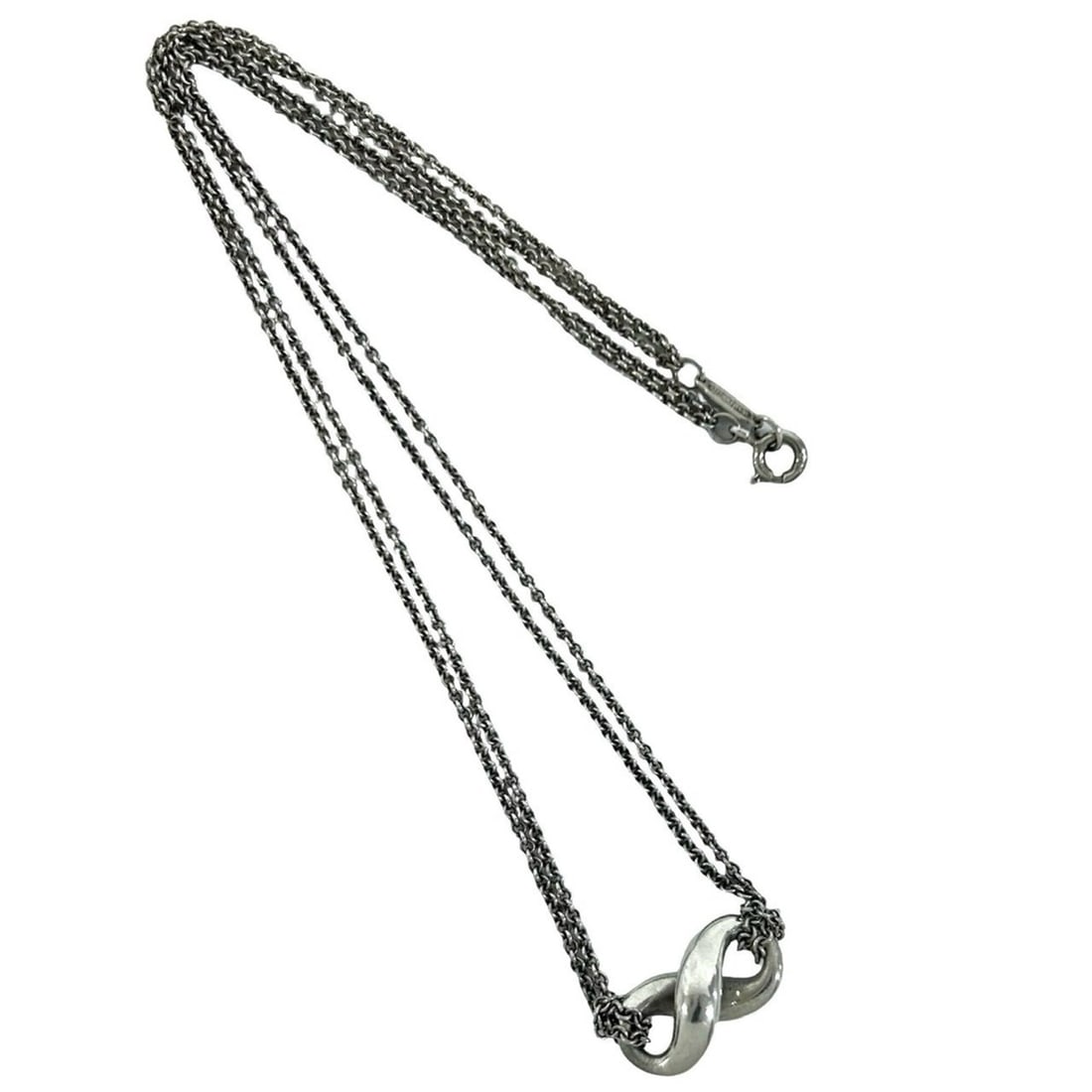 TIFFANY&Co. Tiffany Vintage Infinity Necklace, Sterling Silver 925 Pendant, Accessory, 51393: --- Catalog ---Category: SizePendant Size: 8mm x 18mm / 0.31'' x 0.7''Neck Circumference: 40 cm / 15.74''Category: DesignColor: SilverGender: WomenMaterial: Silver 925Pendant Type: PendantNecklace Typ