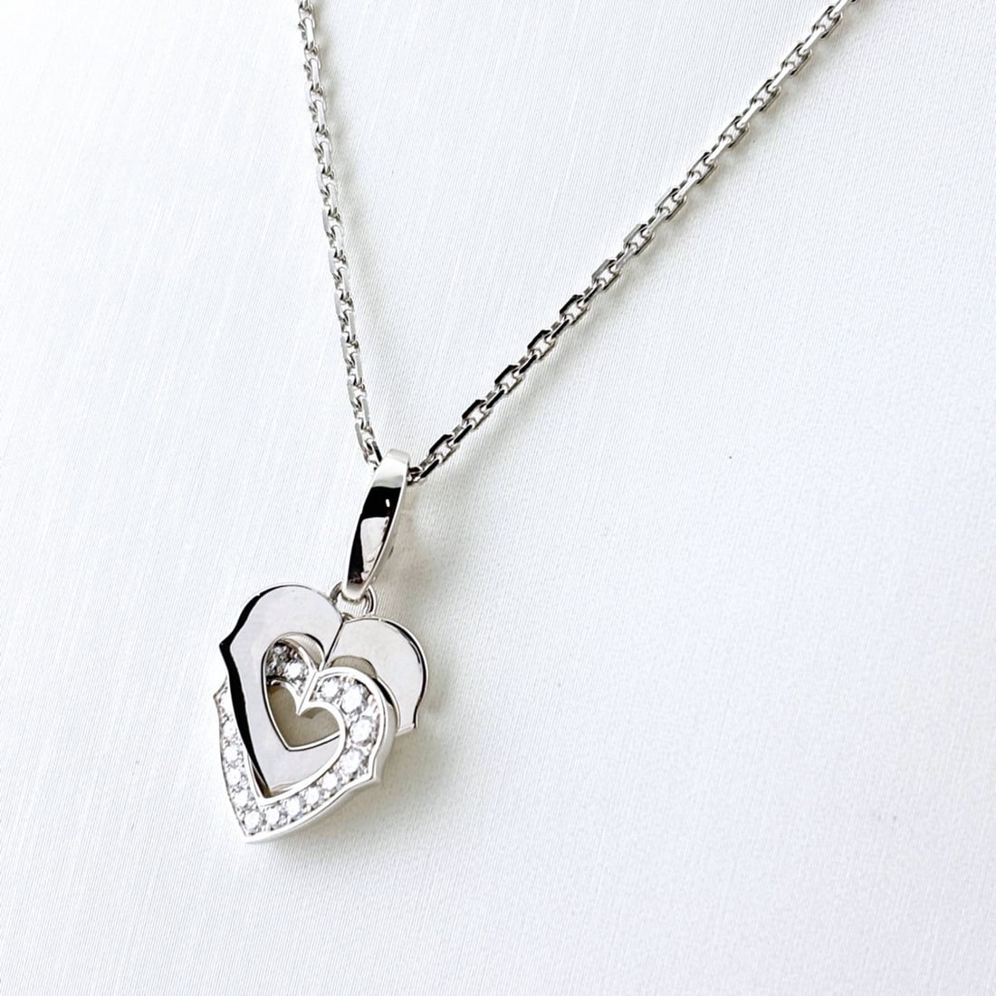 Cartier Double Heart Pendant Necklace with Small Diamonds (750 Diamond) - Women's: --- Catalog ---Category: SizePendant Size: 26.8mm x 13.8mm / 1.05'' x 0.54''Neck Circumference: 42 cm / 16.53''Category: DesignStone: DiamondGender: WomenNecklace Type: NecklaceCategory: GeneralBrand: