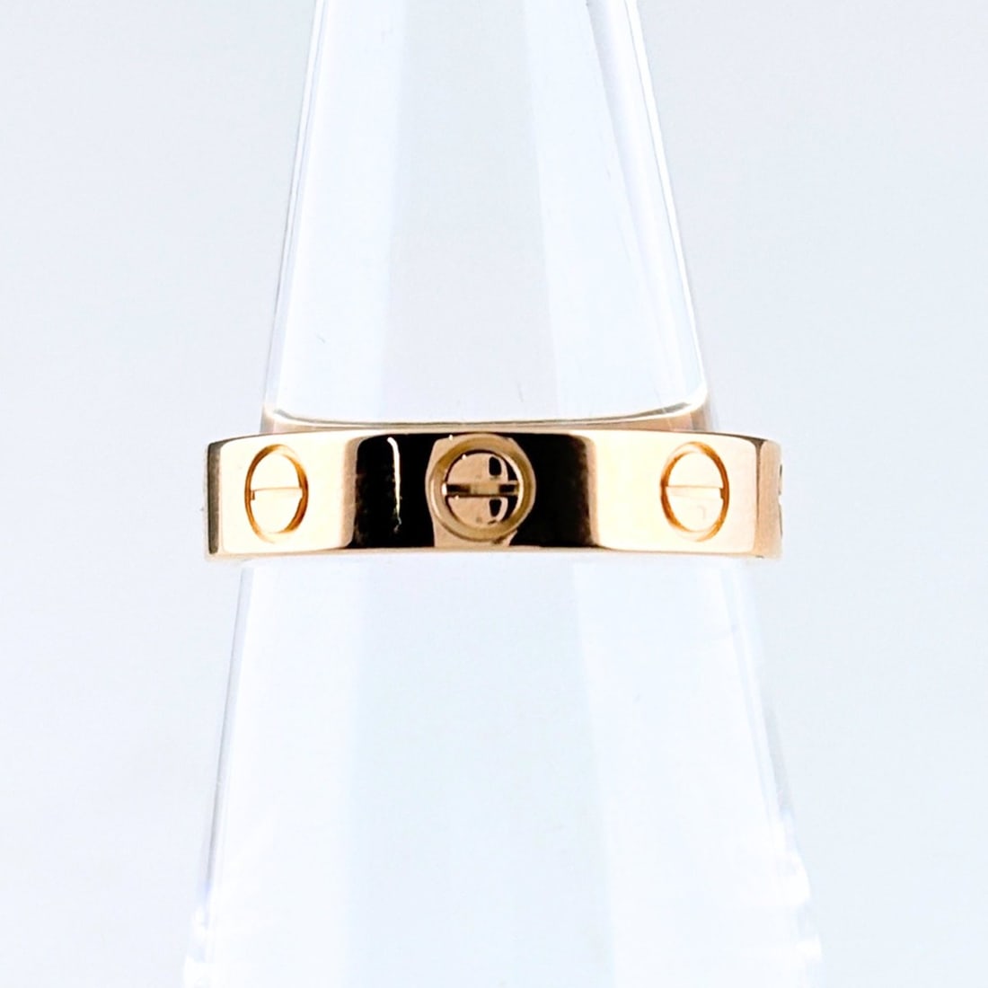 Cartier Mini Love Ring PG Pink Gold 750 Women's: --- Catalog ---Category: SizeUS Size: 4.5Brand Size: 48Category: DesignType: Band ringGender: WomenMaterial: Pink gold (18K)Category: GeneralMPN: B4085248Brand: Cartier--- Item List ---Section: Condit