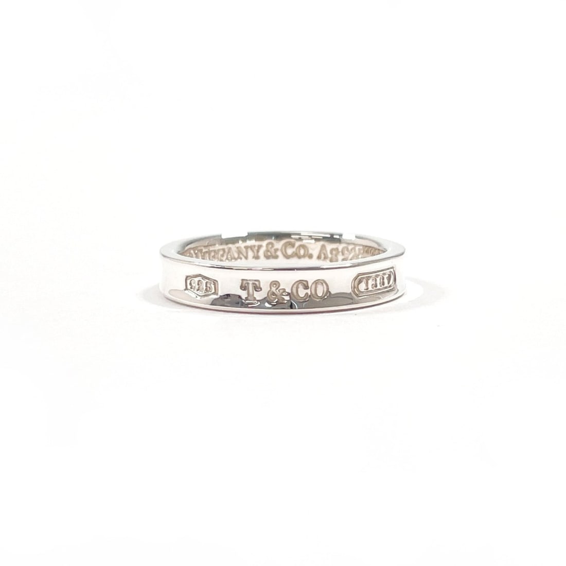 TIFFANY&Co. Tiffany 1837 Narrow Ring, Sterling Silver 925, Size 14, Unisex: --- Catalog ---Category: SizeJP Size: 14US Size: 7Category: DesignType: Band ringColor: SilverMaterial: Silver 925Category: GeneralBrand: Tiffany--- Item List ---Section: ConditionRanking: Rank A Used