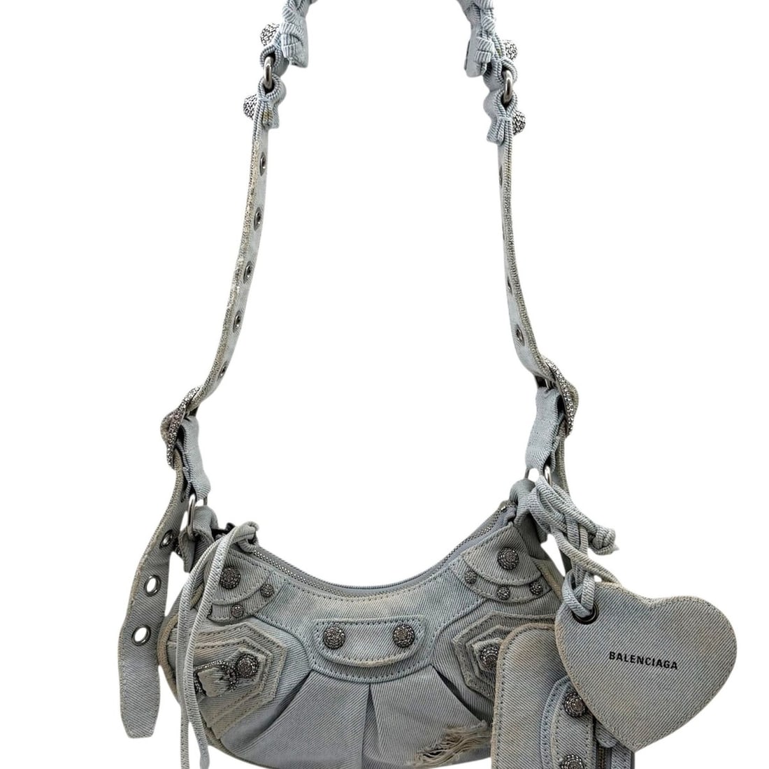 BALENCIAGA Le Cagole denim shoulder bag XS, blue with rhinestone heart design, for women.: --- Catalog ---Category: SizeSize (HxWxD): 12cm x 25cm x 6cm / 4.72'' x 9.84'' x 2.36''Strap Length: 30cm - 88cm / 11.81'' - 34.64''Category: DesignType: Shoulder bagColor: BlueStyle: Vintage reproduc