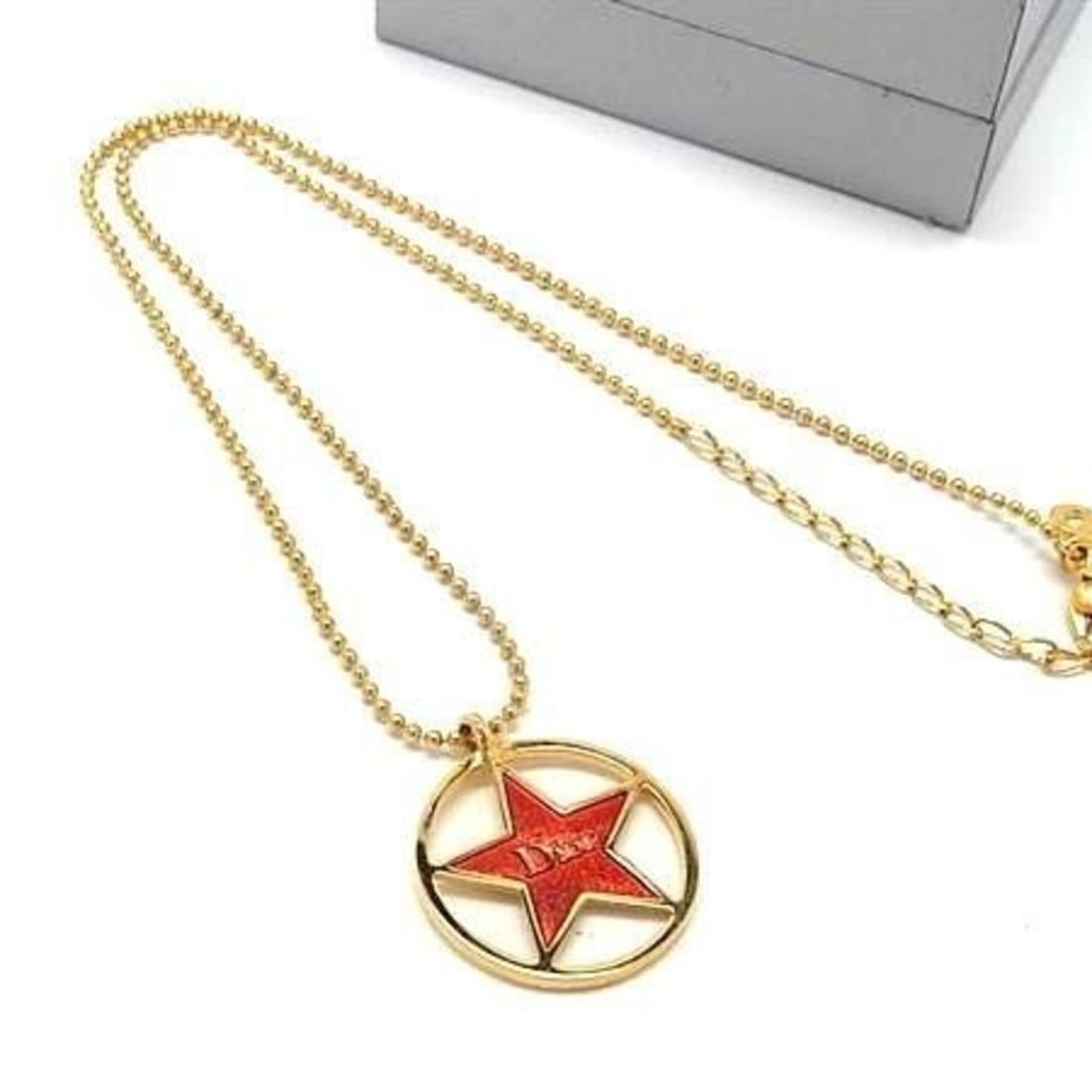 Christian Dior Star Pendant Necklace, Gold and Red Metal, for Women: --- Catalog ---Category: SizeNeck Circumference: 43 cm / 16.92''Category: DesignColor: Red colorStyle: FashionGender: WomenMaterial: MetalPendant Type: PendantNecklace Type: NecklaceCategory: GeneralB