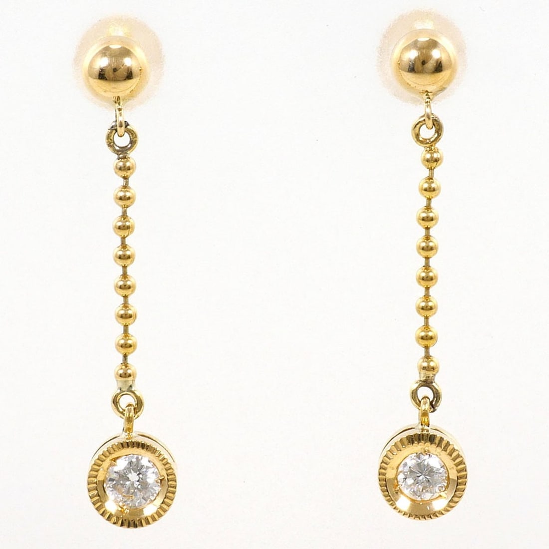 18K (18-karat) Yellow Gold (YG) Earrings with 0.08ct Diamonds, Total Weight 1.4g, Jewelry: --- Catalog ---Category: SizeWeight: 1.4g / 0.04oz.Category: DesignType: Drop earringsColor: Yellow goldMetal: GoldStone: DiamondGender: WomenMaterial: Yellow gold (14K), Yellow gold (18K)Metal Purity