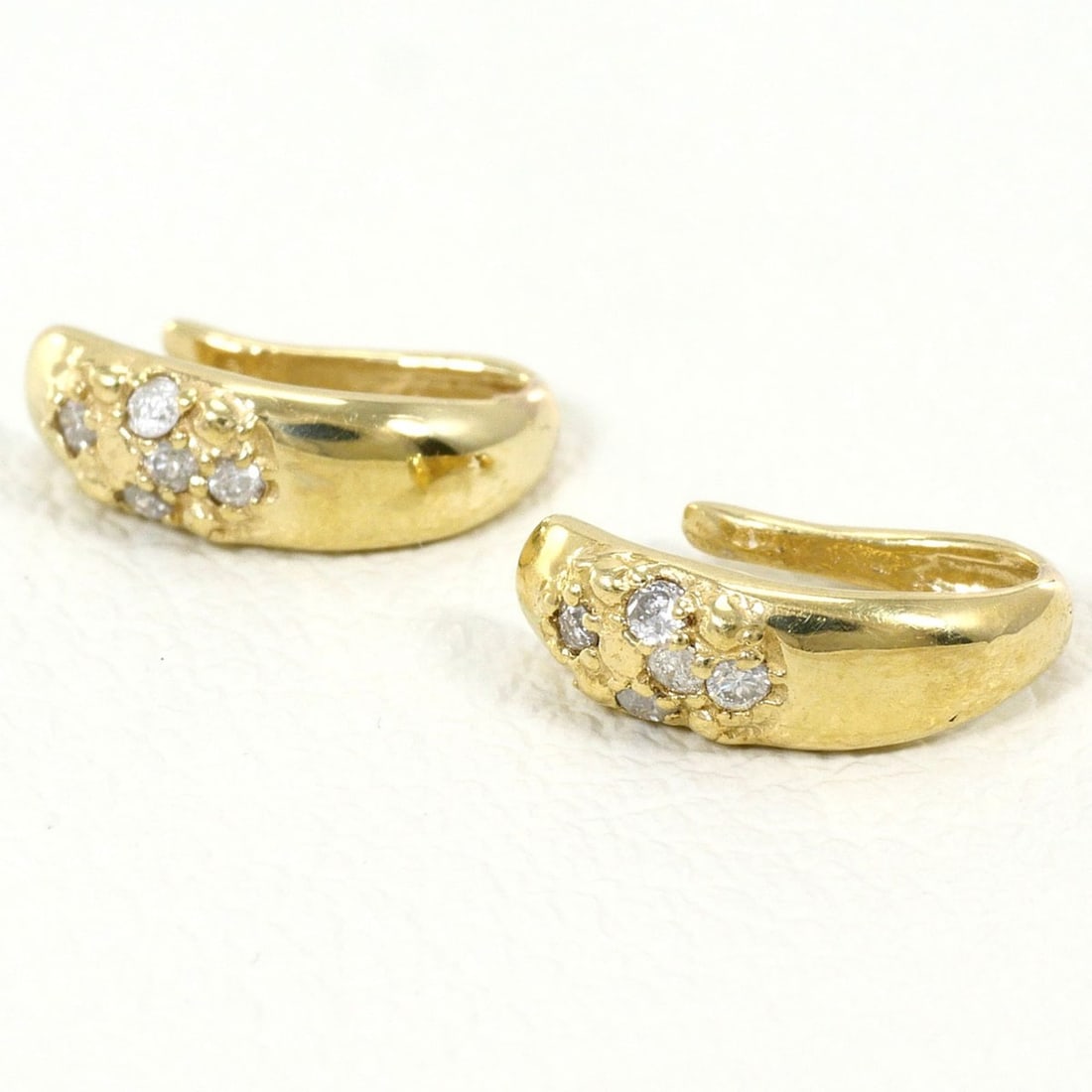Ear cuff, K10 (10k) yellow gold, diamond 0.025 ct, total weight 0.5g, jewelry.: --- Catalog ---Category: SizeWeight: 0.5g / 0.01oz.Category: DesignType: EarcuffColor: Yellow goldMetal: GoldStone: DiamondGender: WomenMaterial: Yellow gold (10K)Metal Purity: 10KWeight (ct.): 0.025C