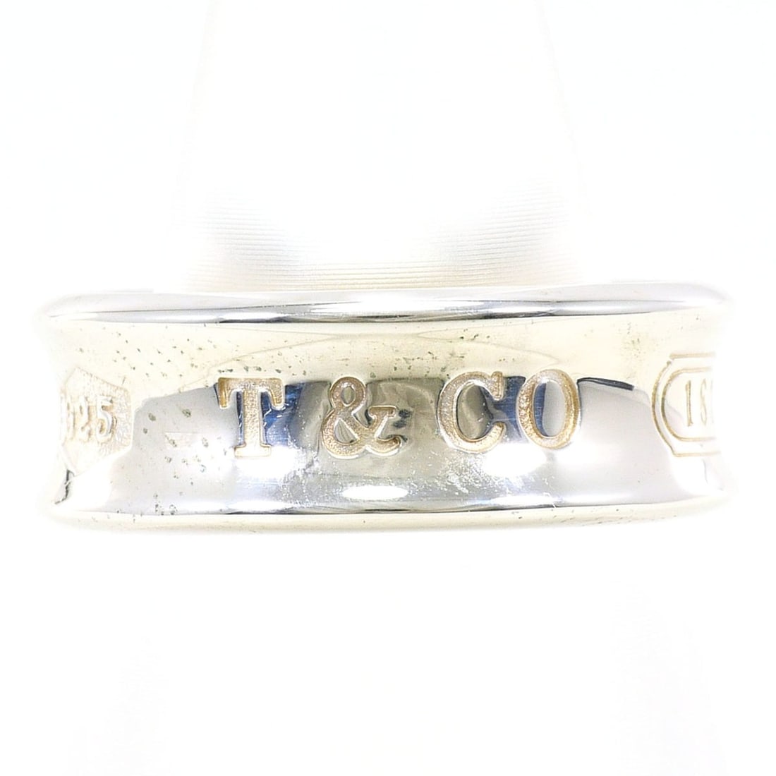 Tiffany & Co. 1837 Silver Ring, Total Weight 7.3g, Jewelry: --- Catalog ---Category: SizeWidth: 7mm / 0.28''Weight: 7.3g / 0.25oz.JP Size: 9.5US Size: 5Category: DesignType: Band ringGender: WomenMaterial: Silver 925Category: GeneralLine: 1837Brand: Tiffany---
