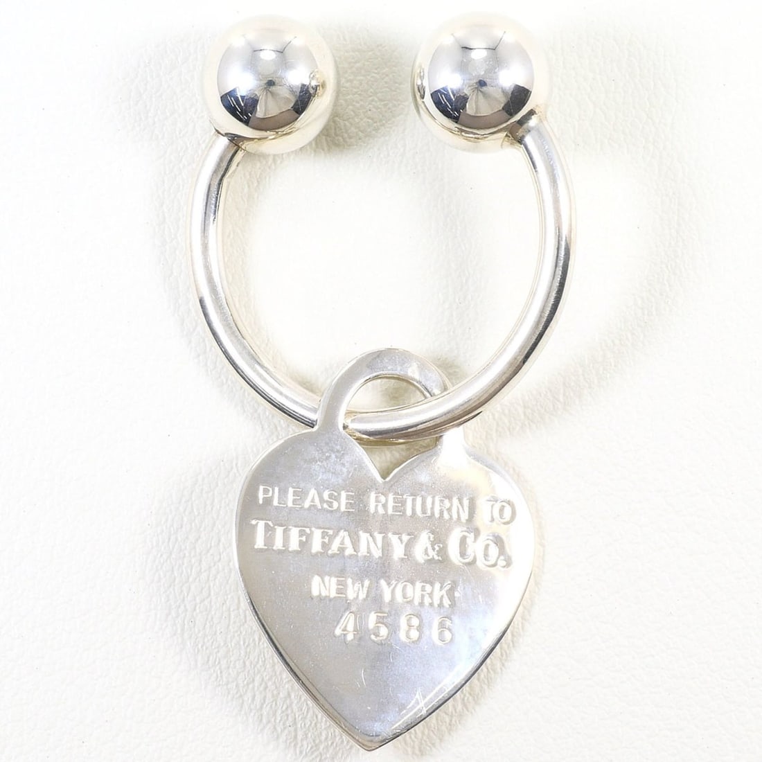 Tiffany & Co. Heart Tag Keyring, Silver, Total Weight 9.0g, Jewelry: --- Catalog ---Category: SizeWeight: 9g / 0.31oz.Size (HxWxD): 5cm x 2.7cm / 1.96'' x 1.06''Category: DesignType: KeyringGender: WomenMaterial: SilverPattern (Charm): HeartsCategory: GeneralBrand: Tif