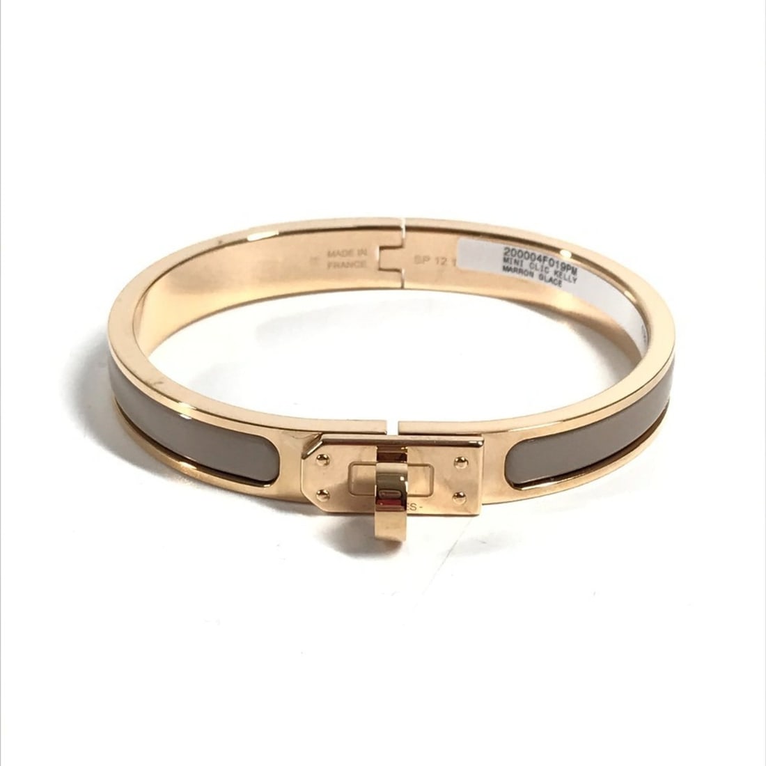 HERMES Mini Click Kelly PM Accessory Jewelry Bracelet Metal Men's Women's Marron Glacé Beige Like: --- Catalog ---Category: SizeLength: 15.5cm / 6.1''Category: DesignType: Charm braceletColor: BeigeGender: Men,Women,UnisexMaterial: MetalColor Grade: LCategory: GeneralLine: ClicBrand: HermesCountry 