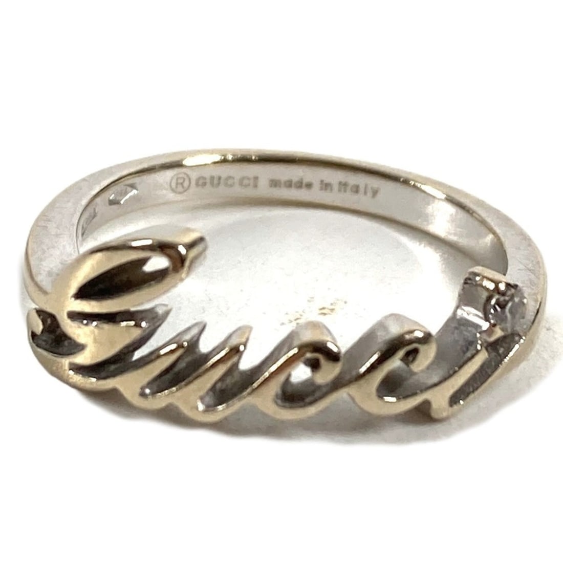 GUCCI 18K Gold Logo 1PD Diamond Ring - WG750 Silver Women's Jewelry: --- Catalog ---Category: SizeWeight: 2g / 0.07oz.JP Size: 6US Size: 3.5Category: DesignType: Band ringColor: SilverStone: DiamondGender: WomenMetal Purity: 18KCategory: GeneralBrand: GucciCountry of O