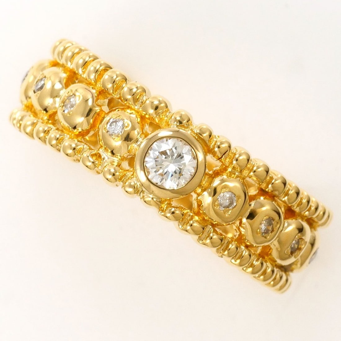 18K (18-karat) Yellow Gold Ring with 0.07ct and 0.12ct Diamonds, Certificate of Authenticity, Total: --- Catalog ---Category: SizeWidth: 6mm / 0.24''Weight: 5.1g / 0.17oz.JP Size: 13US Size: 6.5Category: DesignType: Band ringColor: Yellow goldMetal: GoldStone: DiamondGender: WomenMaterial: Yellow gol