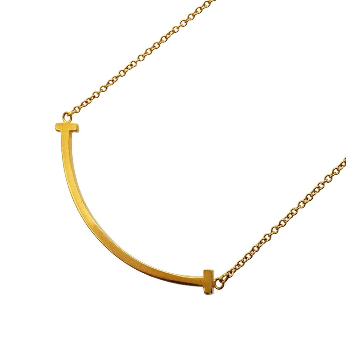 Tiffany & Co. T Smile Small Necklace, 18K Yellow Gold, Women's: --- Catalog ---Category: SizePendant Size: 10mm x 37.8mm / 0.39'' x 1.48''Neck Circumference: 41 cm - 46.5 cm / 16.14'' - 18.3''Category: DesignGender: WomenMaterial: Yellow gold (18K)Necklace Type: N