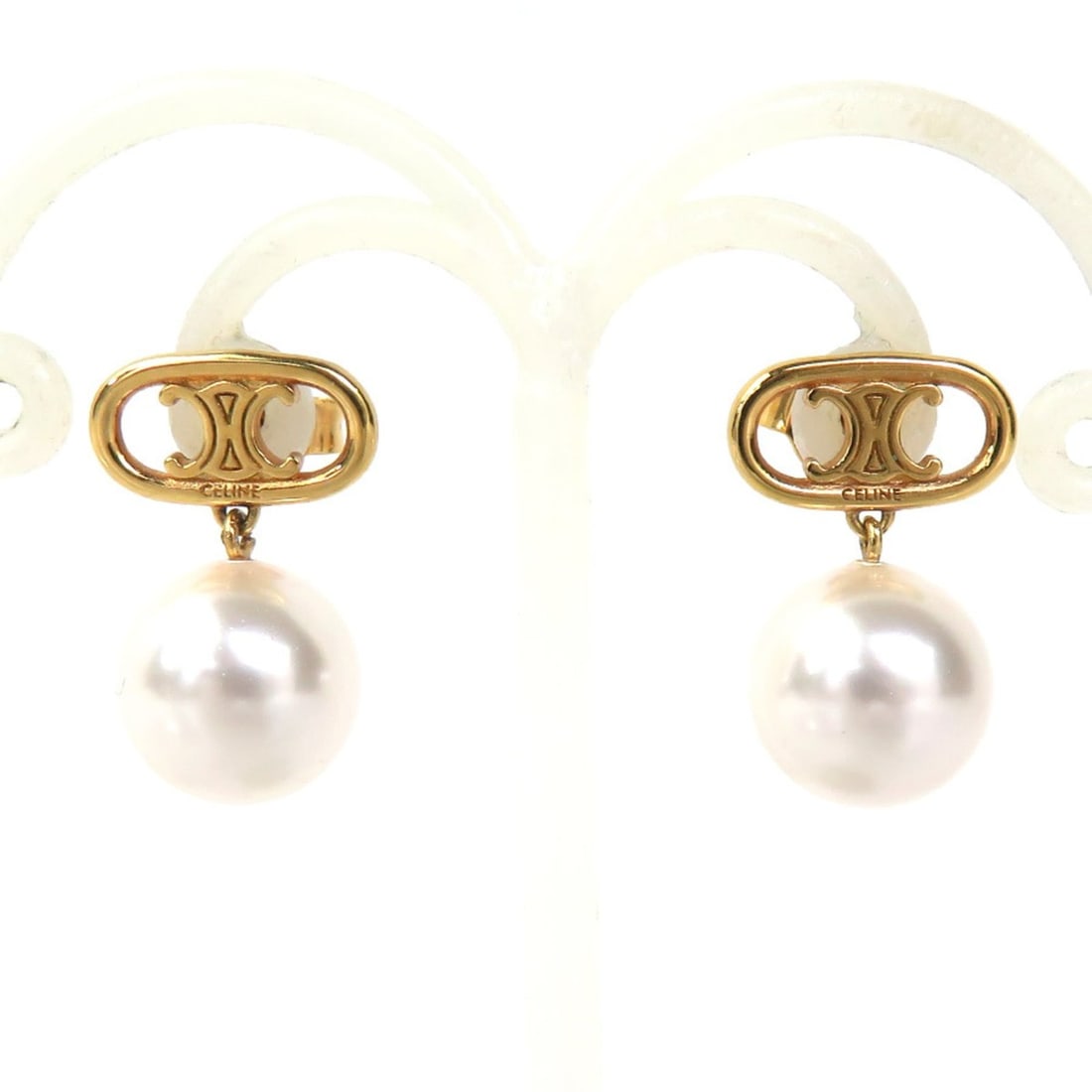 Celine CELINE Earrings, Metal, Faux Pearl, Gold, White, 56783k: --- Catalog ---Category: SizeSize (HxWxD): 18.00mm x 12.00mm / 0.71'' x 0.47''Category: DesignType: Stud earringsColor: Gold, WhiteGender: WomenMaterial: Artificial pearl, MetalCategory: GeneralBrand: